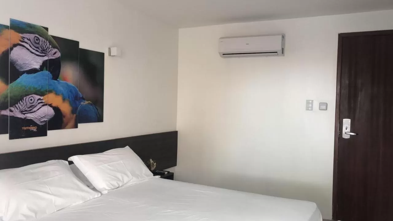 Bed in Pousada Sol e Mar