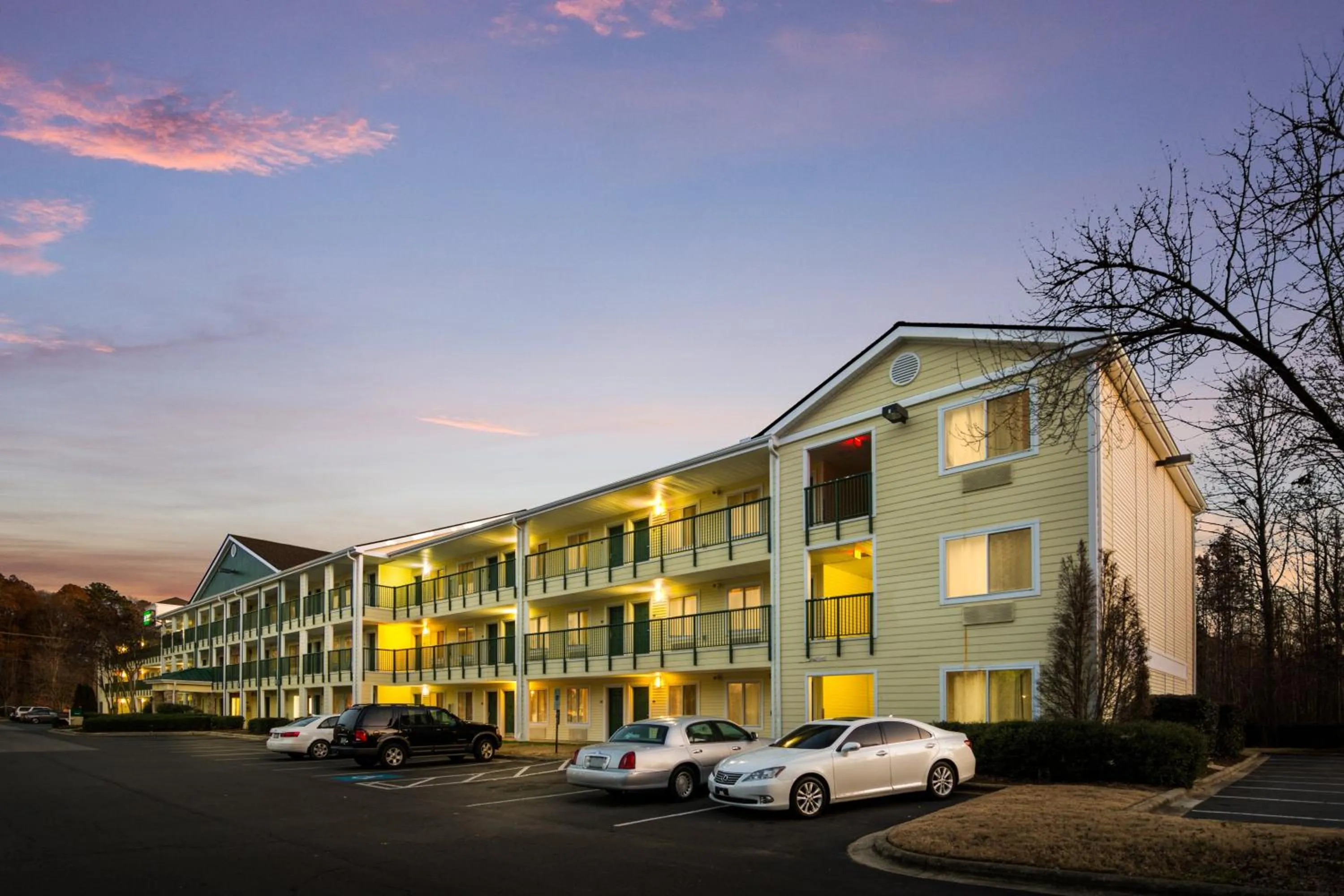 Property building in HomeTowne Studios by Red Roof Raleigh – Durham