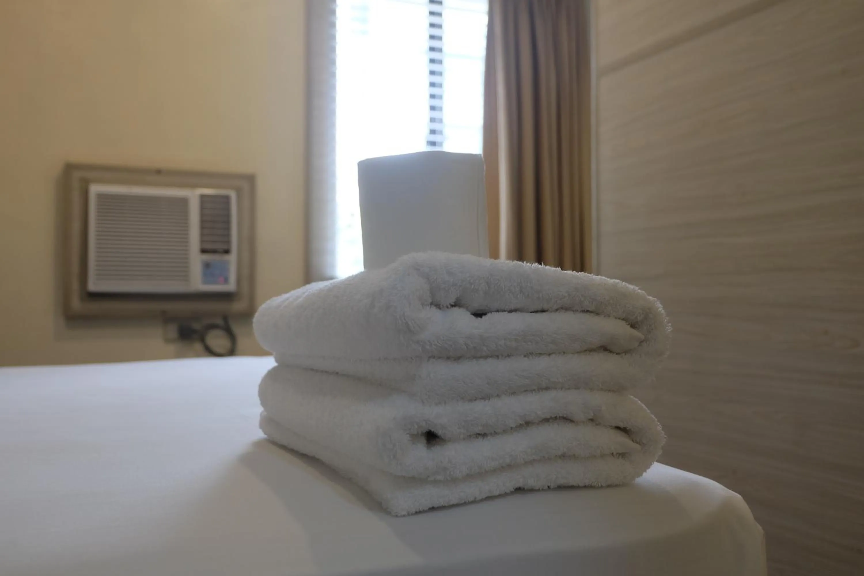 towels, Bed in Spaces Hotel Makati