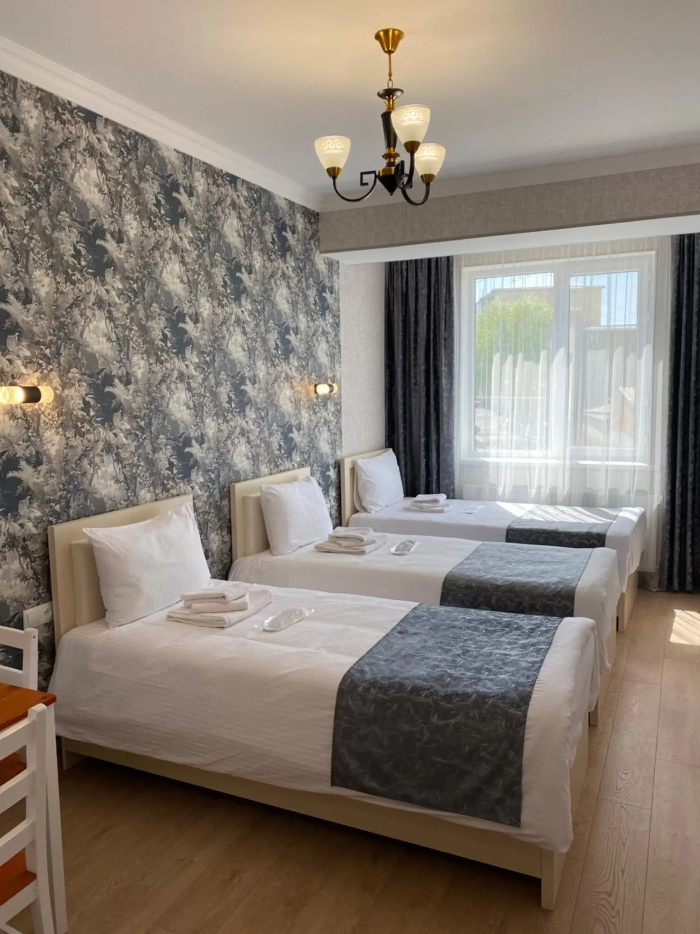 Luxury Triple Room in Hotel Sharl Luxury Triple Room in Hotel Sharl