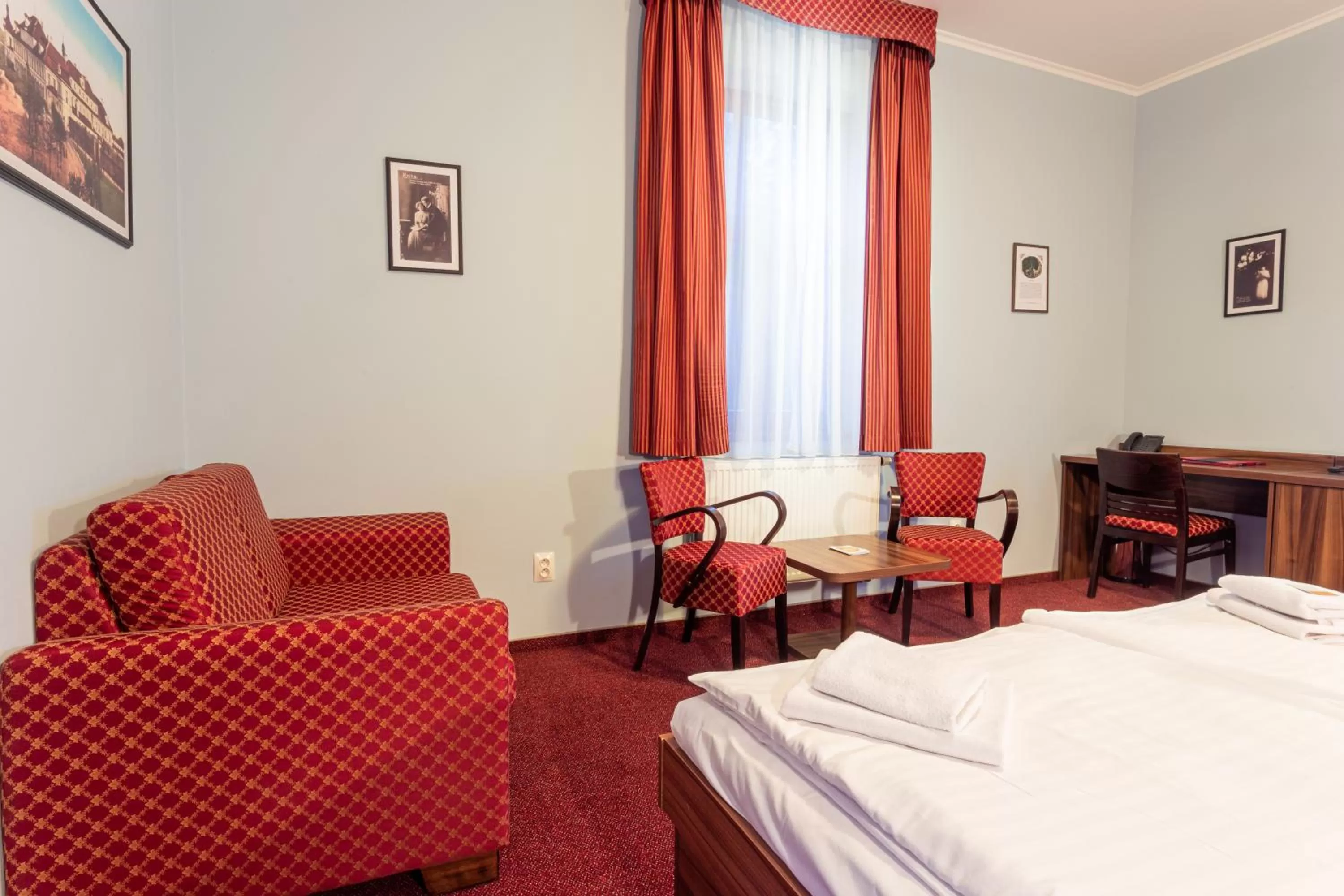 Bed, Seating Area in Hotel Studanka