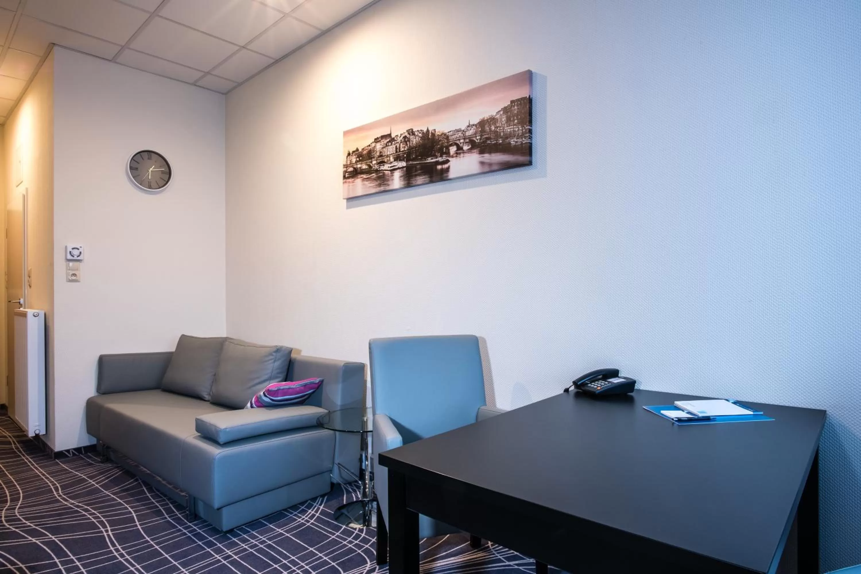 Living room in Sky Business Hotel