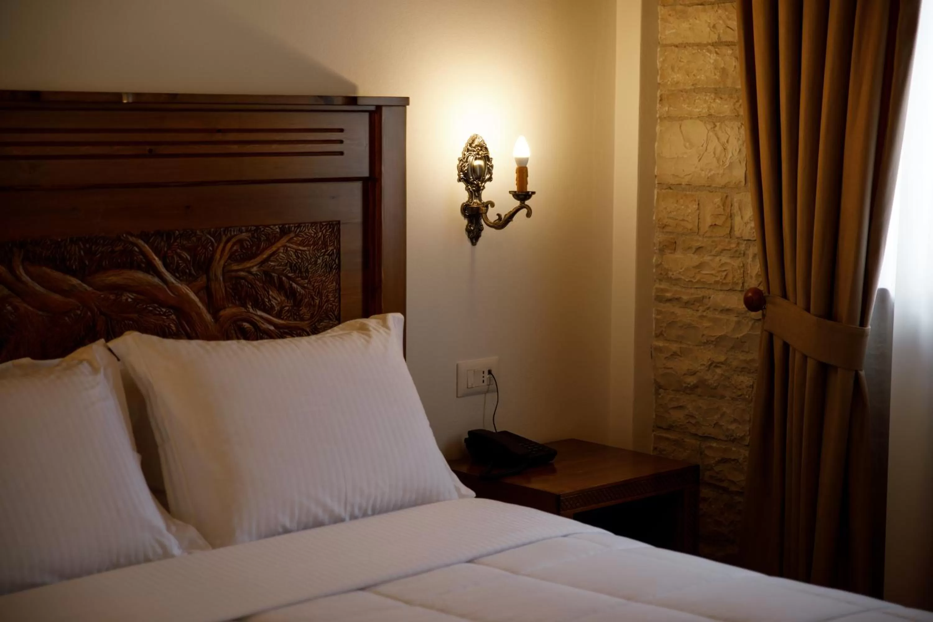 Bed in Rose Garden Hotel