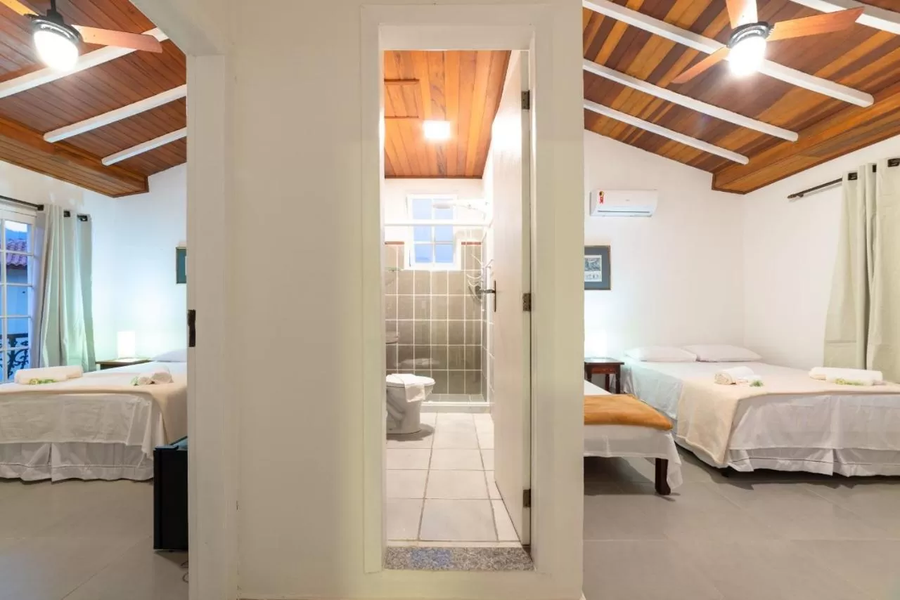 Bed in Pousada Portal de Paraty