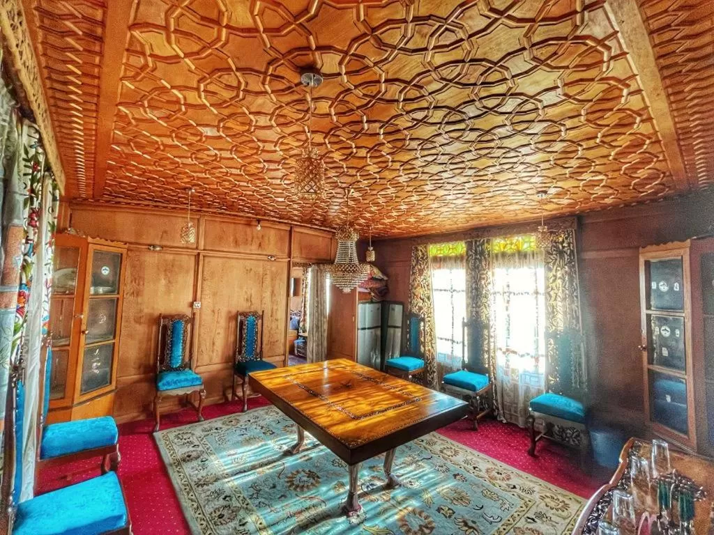 Bed, Seating Area in Nazneen Group Of Houseboats