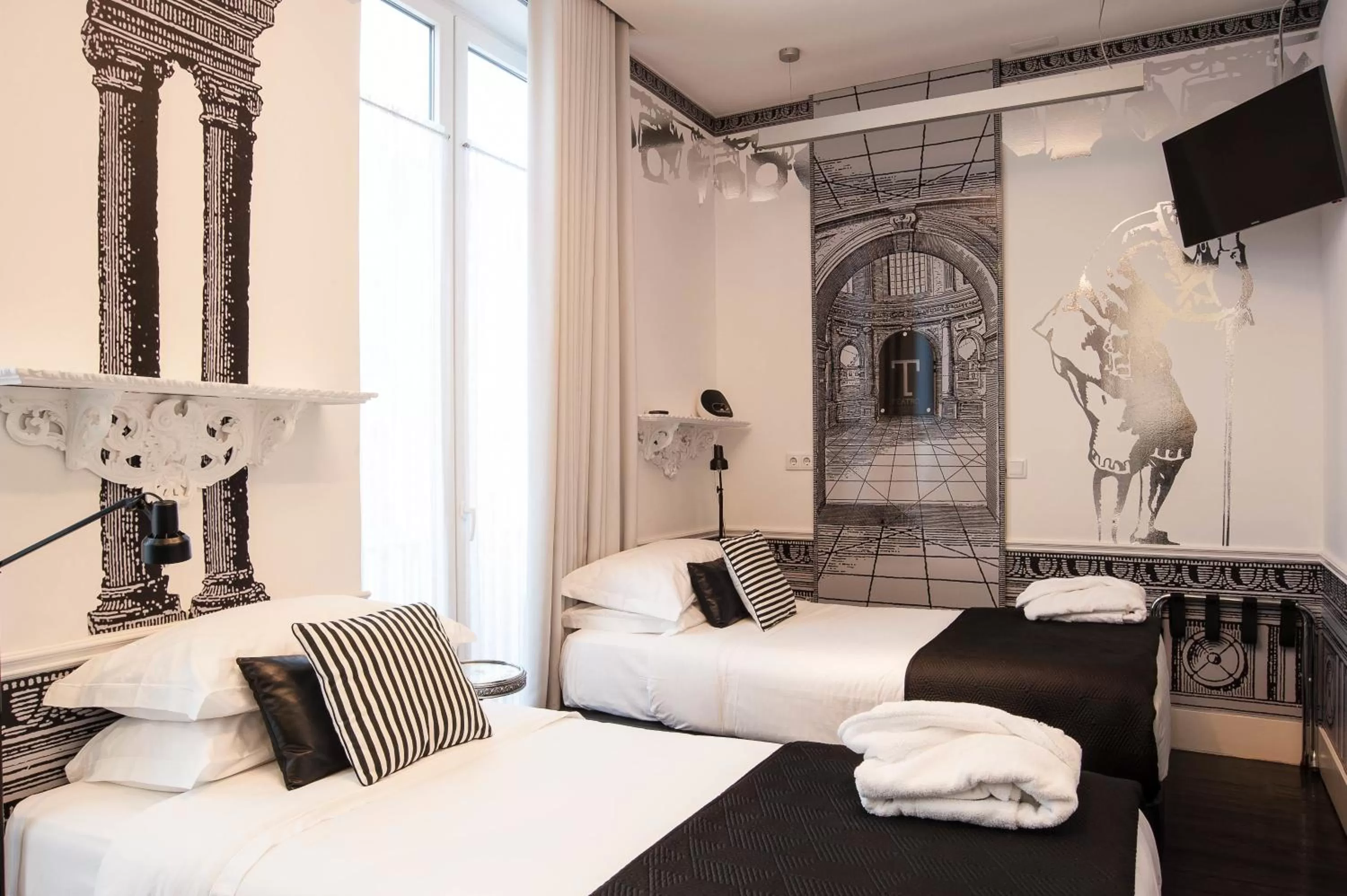 Bed in Teatro Boutique Rooms & Suites