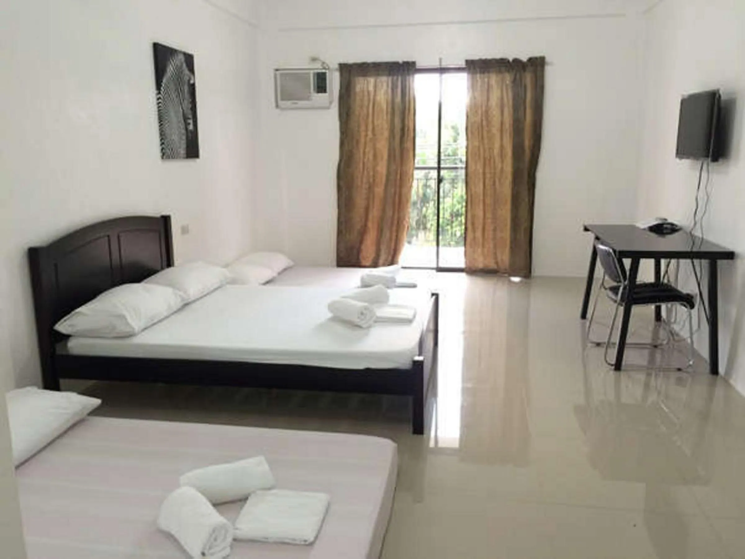 Photo of the whole room, Bed in The Palines Apartment Hotel near Brittany Palazzo, Evia Mall Alabang