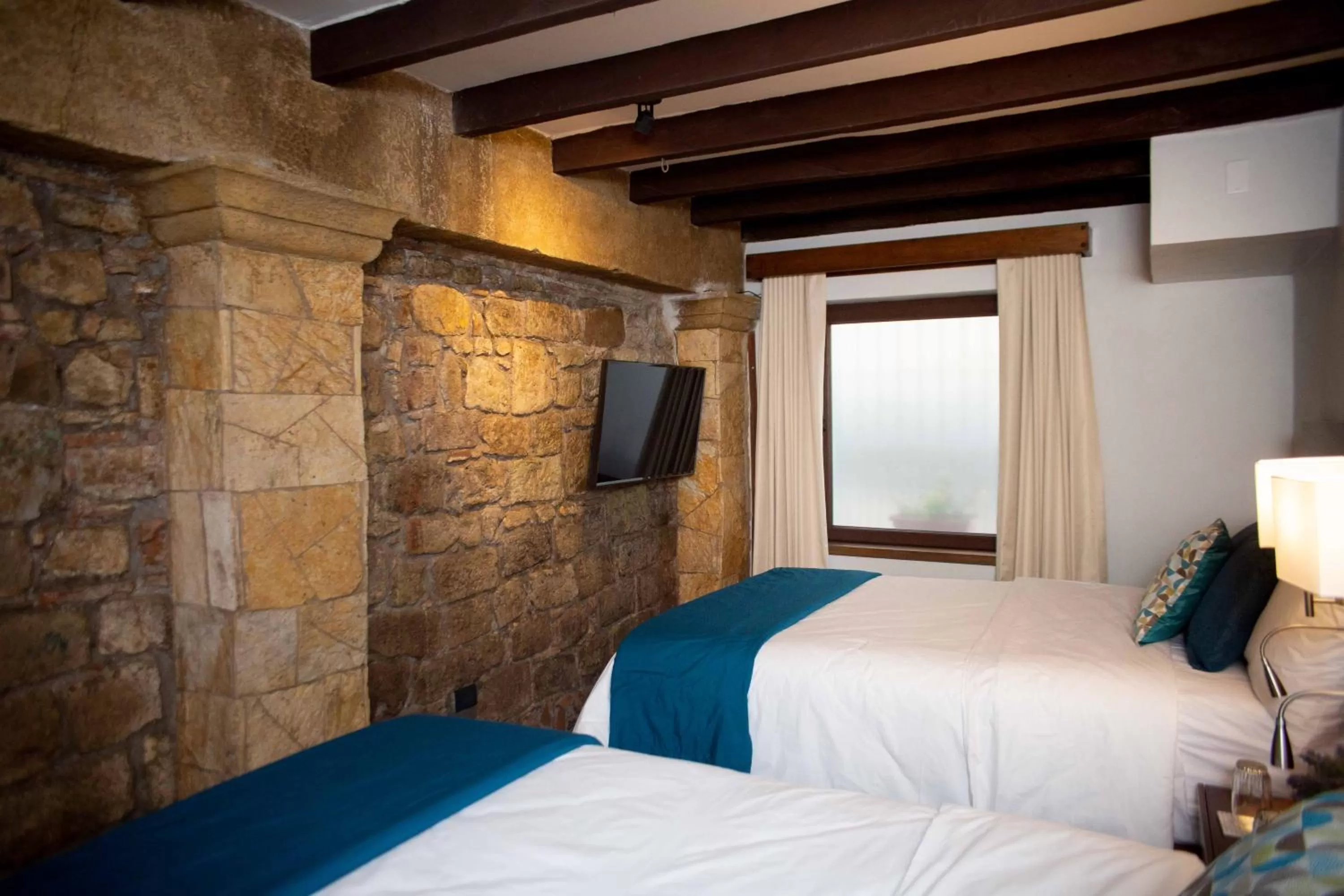 Bed in Casa Villamil Boutique Hotel