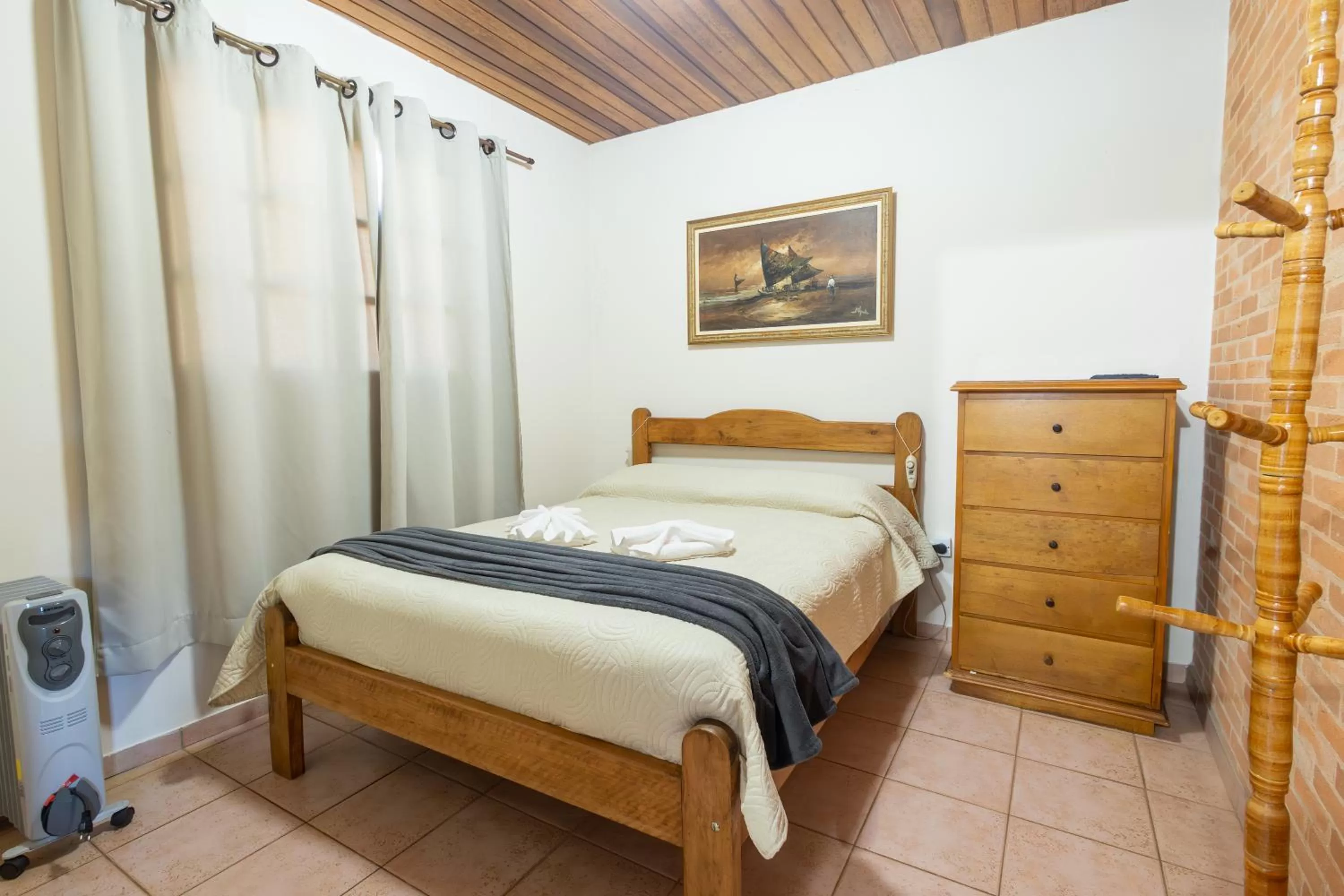 Bed in Chalés 3 Pinheiros