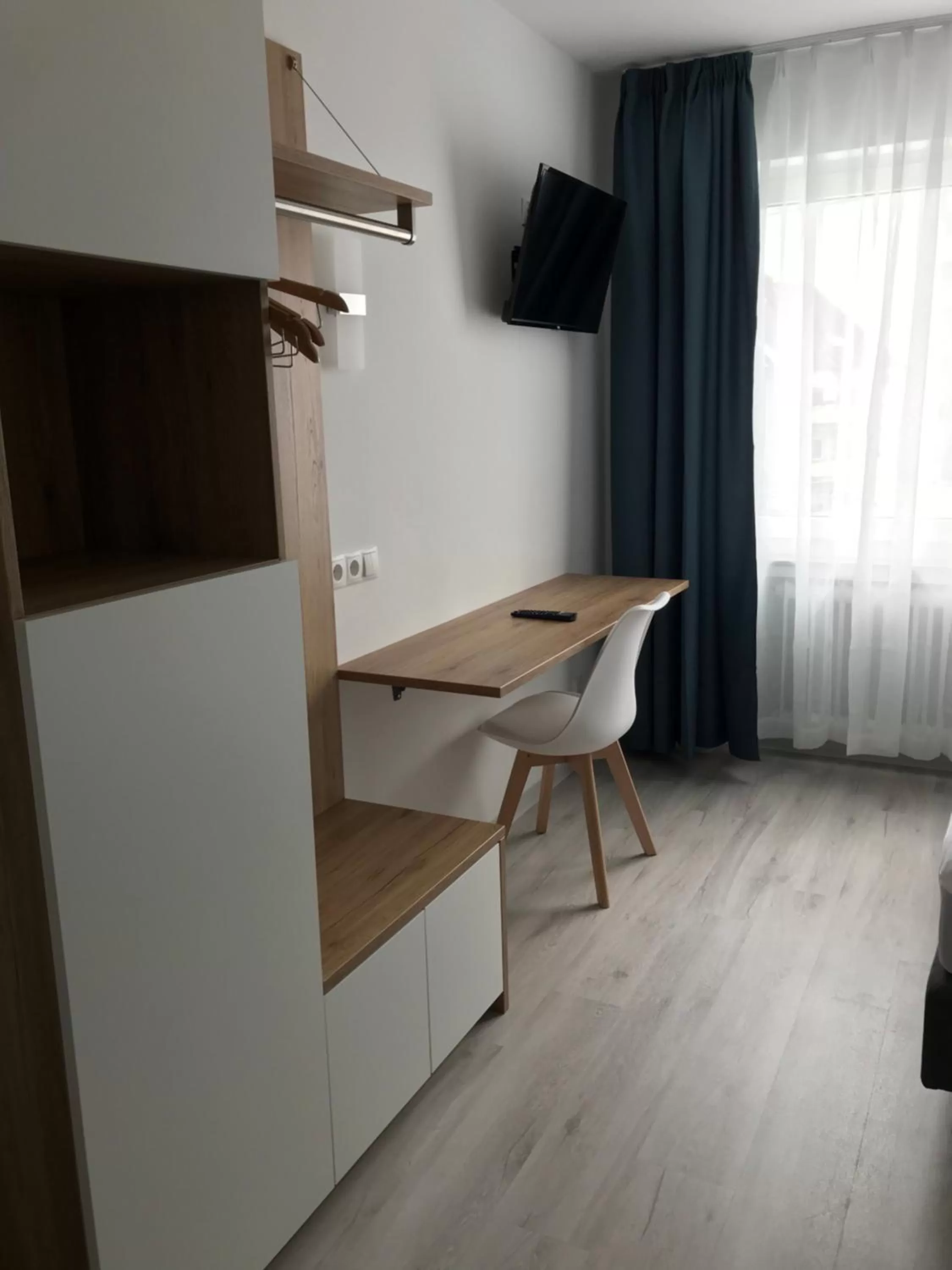 TV and multimedia, TV/Entertainment Center in Hotel 83