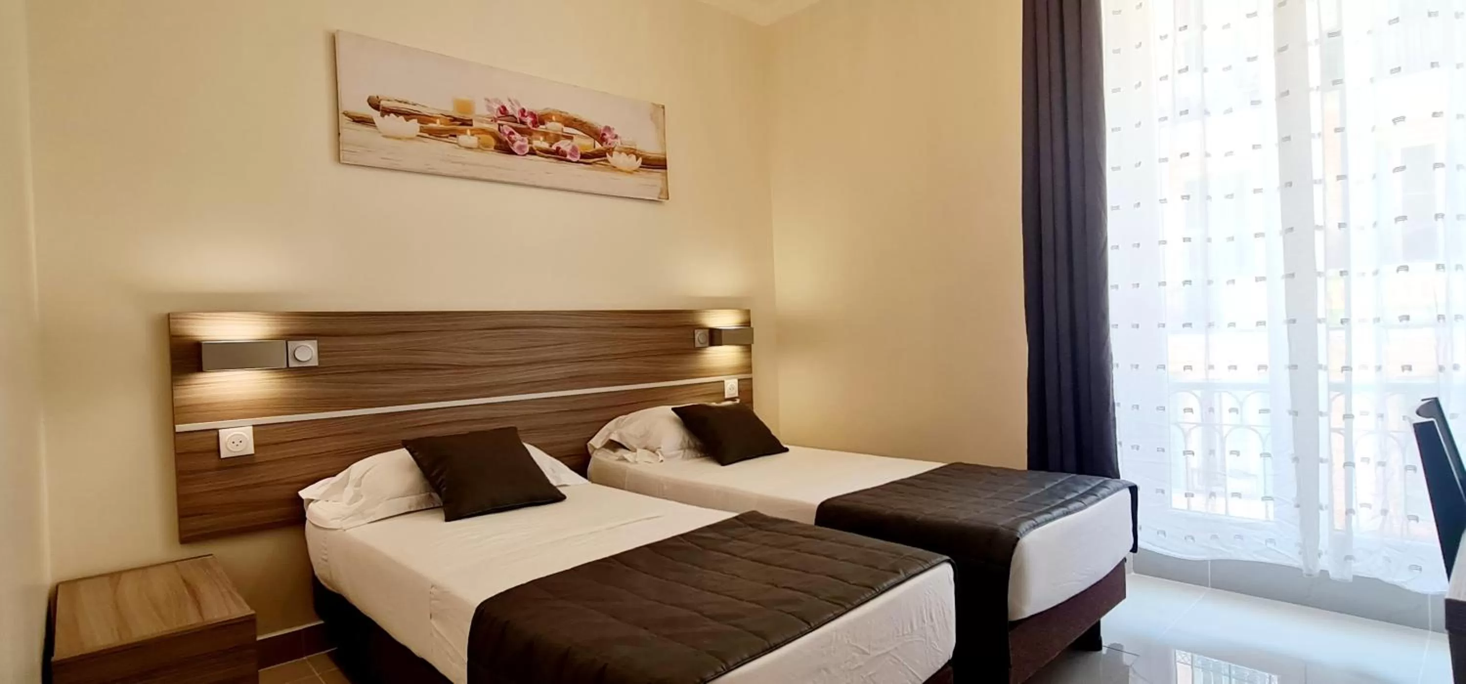 Bed in ESPERANCE HOTEL