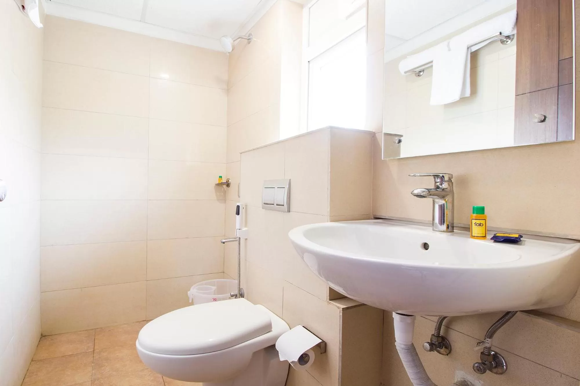 Bathroom in FabHotel Limestone Suites -750M from Yashoda Hospitals, Somajiguda