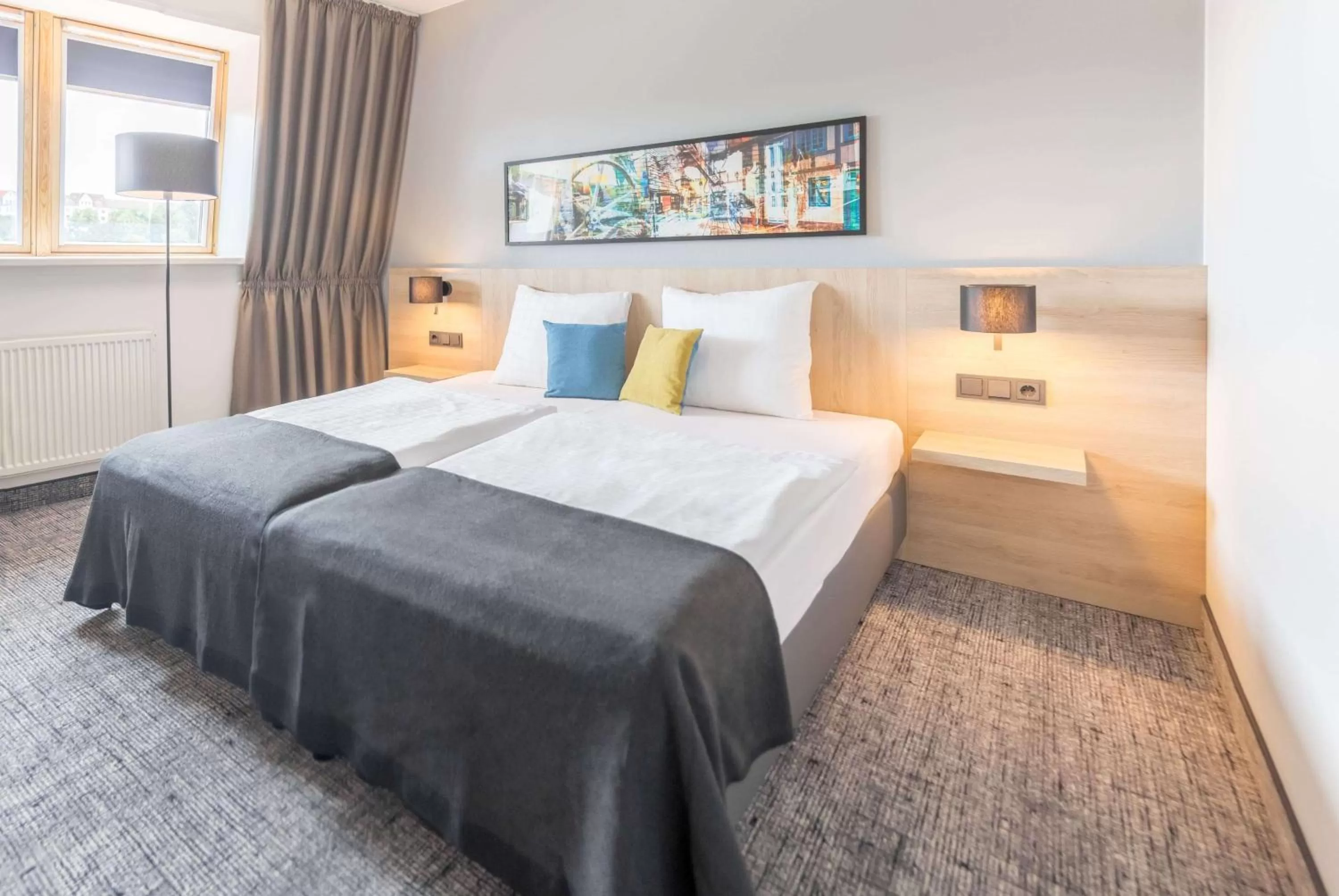 Photo of the whole room, Bed in Ramada by Wyndham Flensburg City