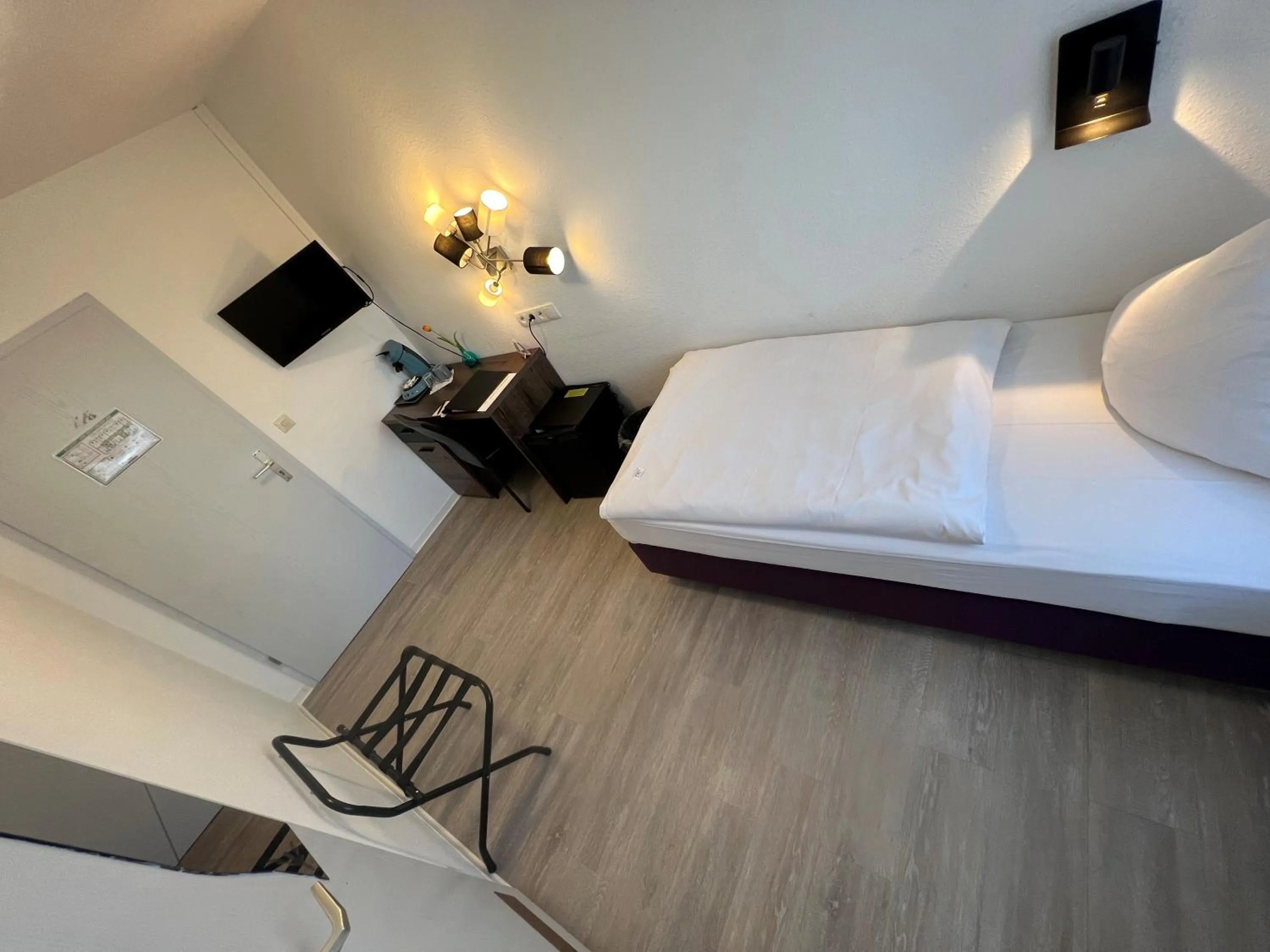 Photo of the whole room, Bed in Hotel Bitzer Backnang