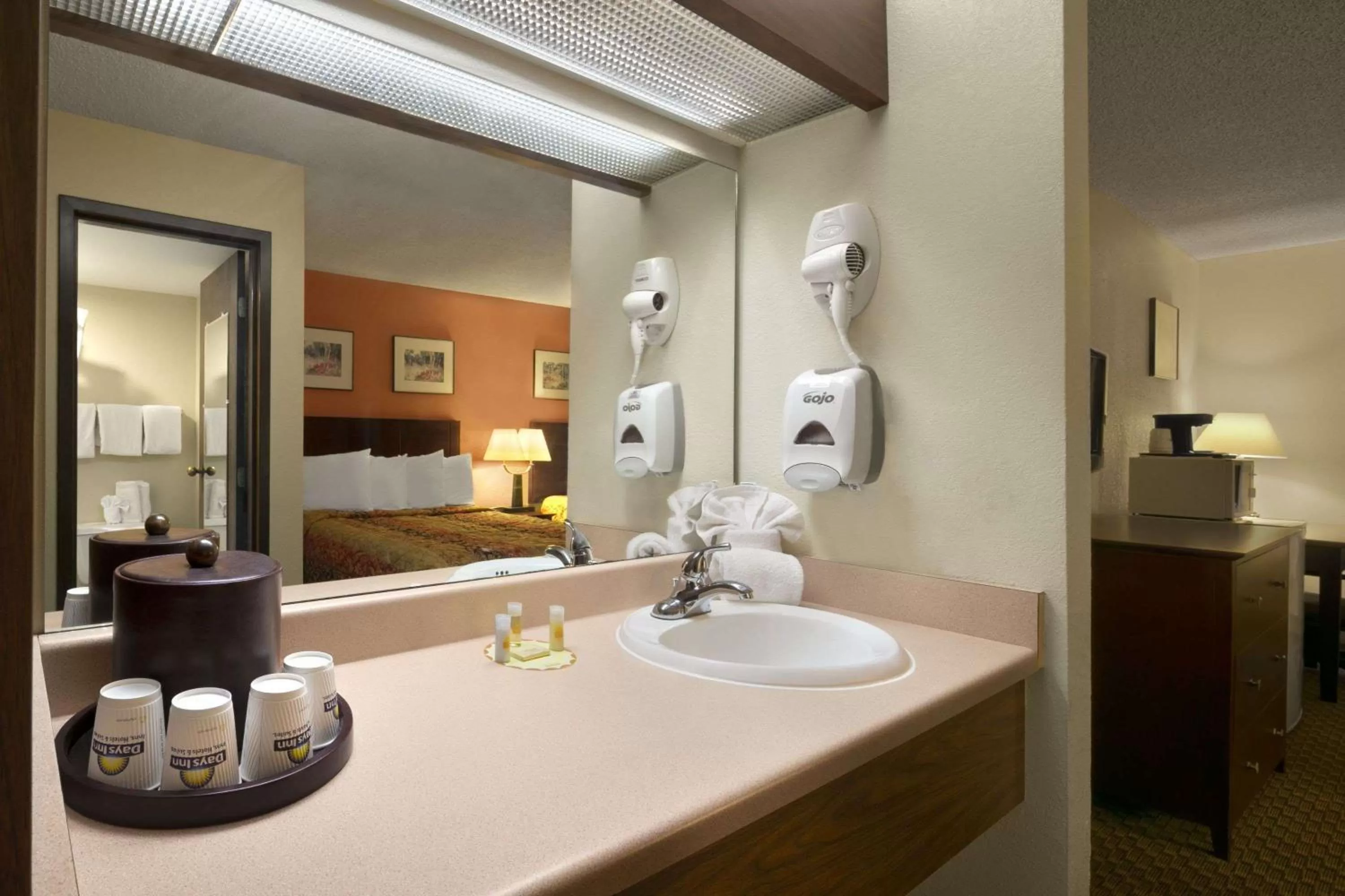Bathroom, Bed in Days Inn & Suites by Wyndham Stevens Point