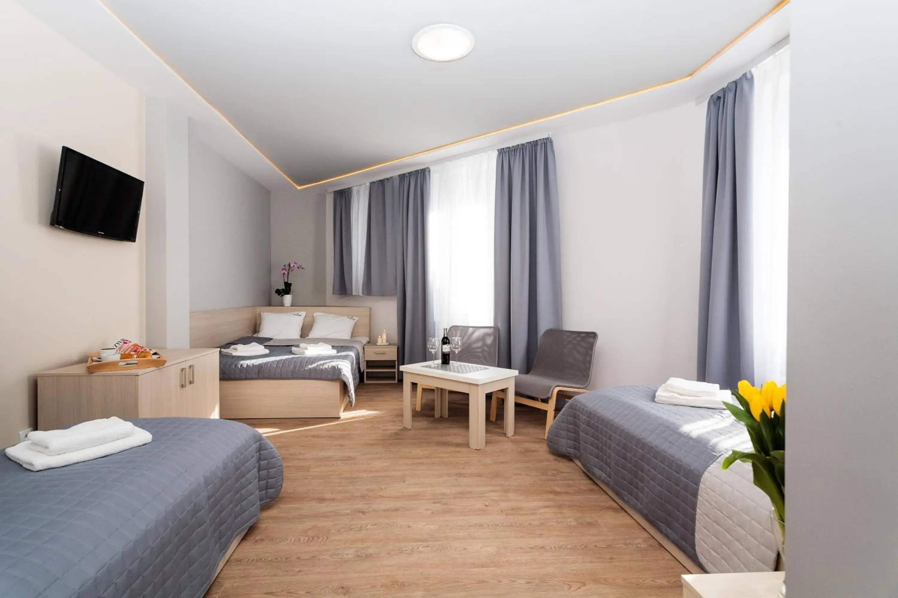Quadruple Room in Apartamenty Platinia - komfortowe noclegi Kraków Stare Miasto Quadruple Room in Apartamenty Platinia - komfortowe noclegi Kraków Stare Miasto