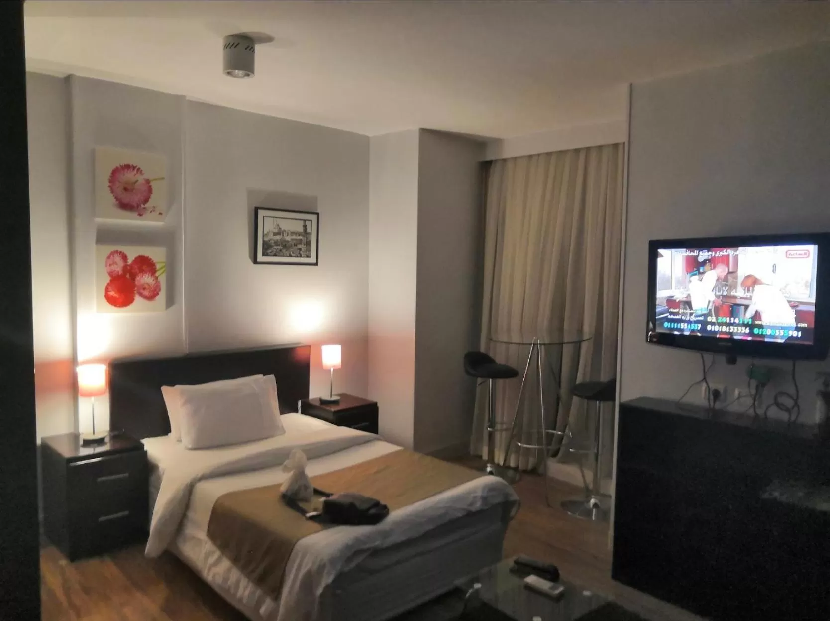 Bed in NewCity Hotel & Suites