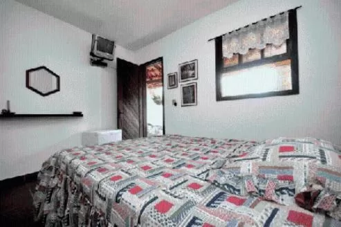 Bed in Pousada A Marca do Faraó