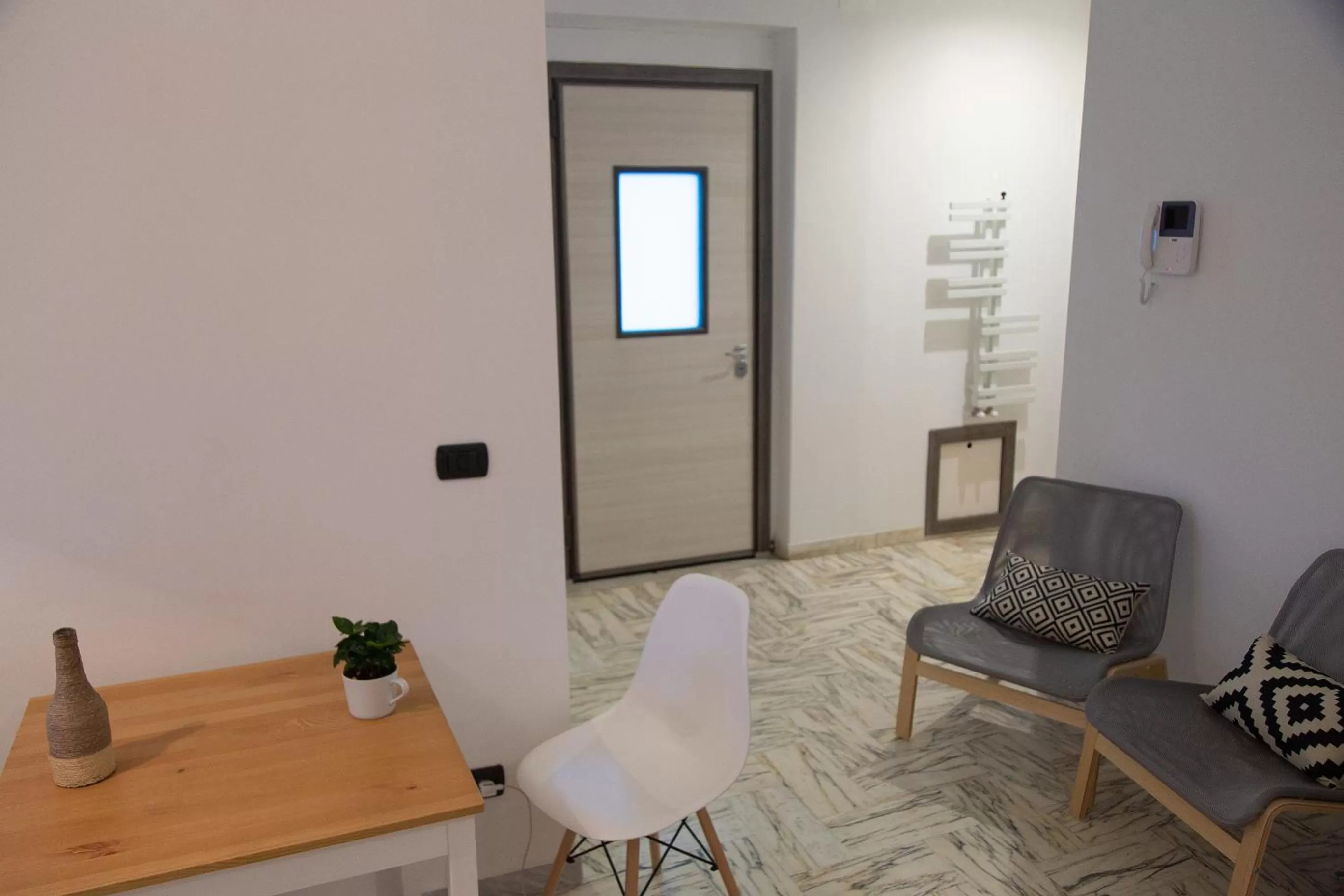 Seating area in UP&B Rooms Catania