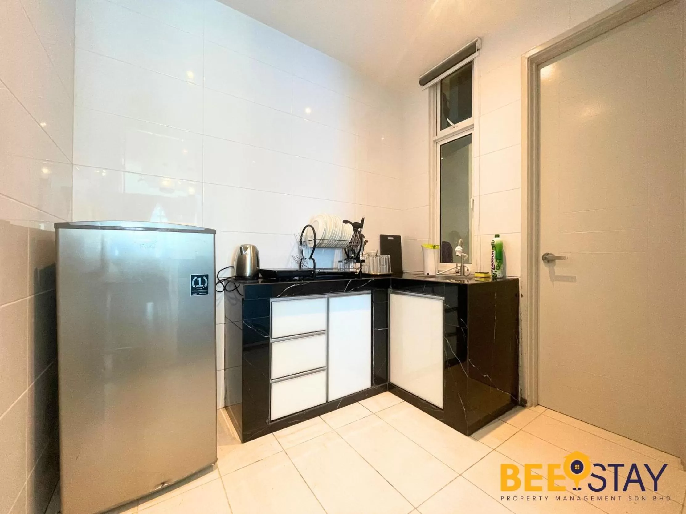 Kitchen/Kitchenette in The Wave Suites Melaka by BEESTAY