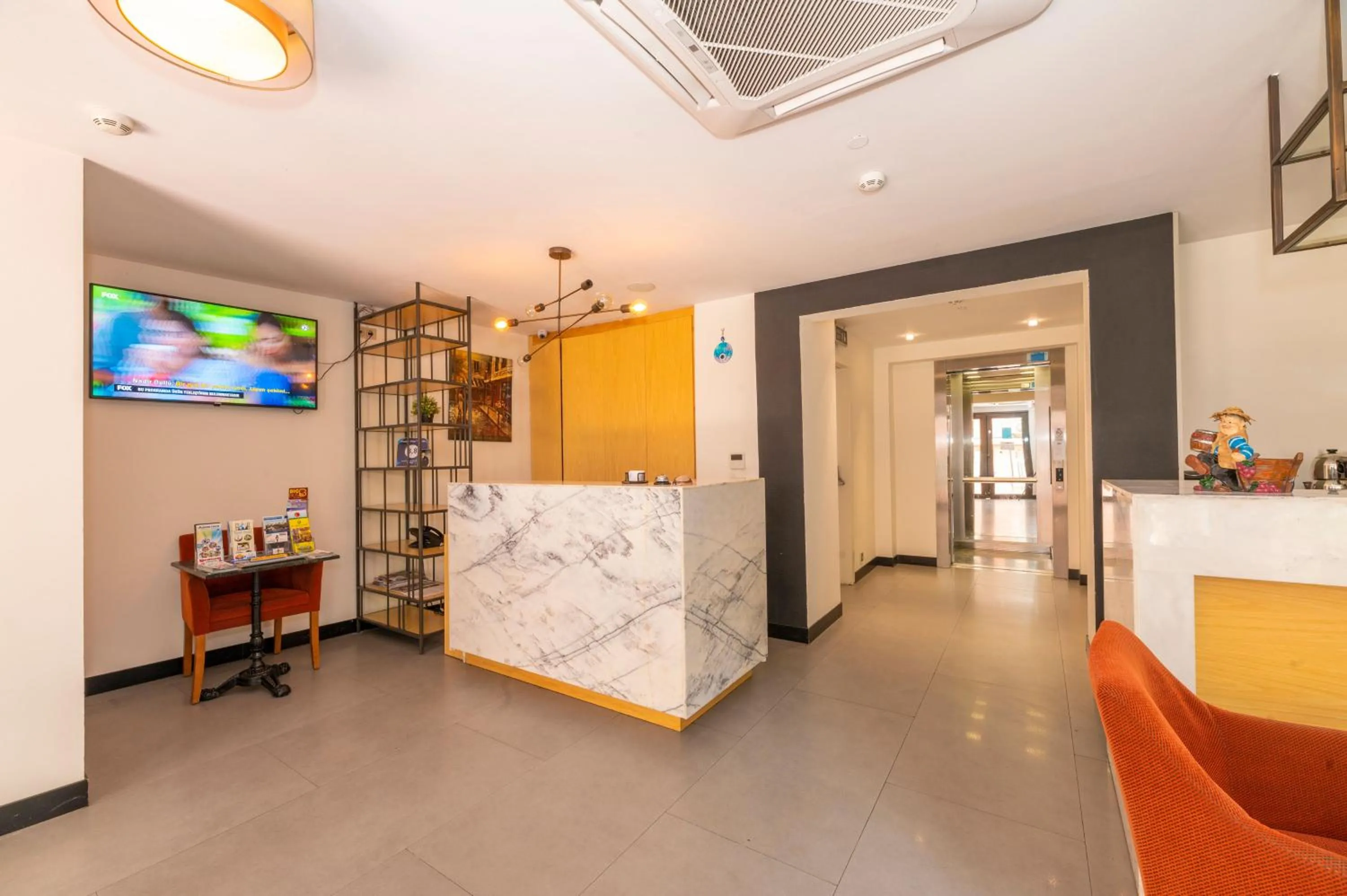 Communal lounge/ TV room in Taksim Hotel V Plus