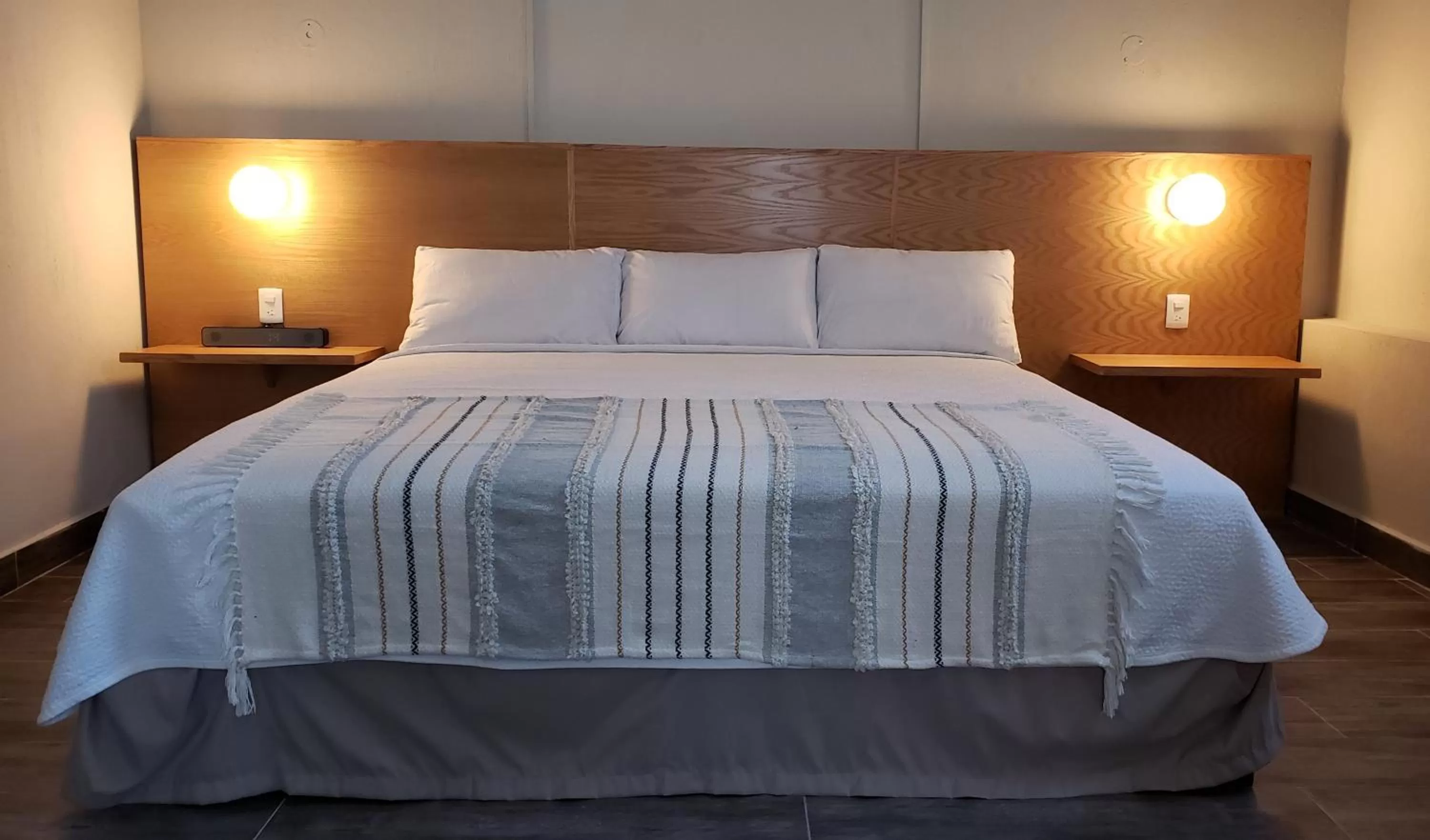 Bed in Hotel Grand Isitia