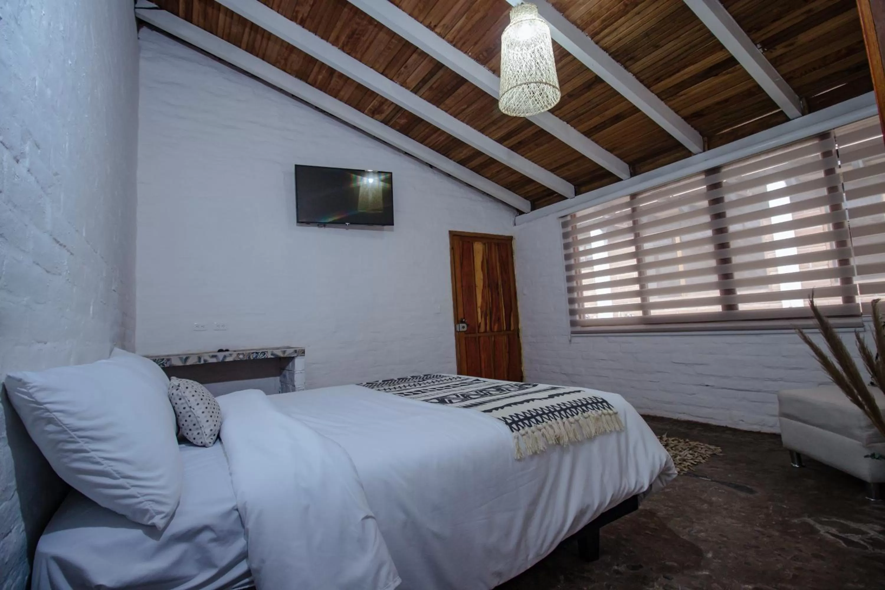 Bed in Rústic Hotel Quinta La Aurora