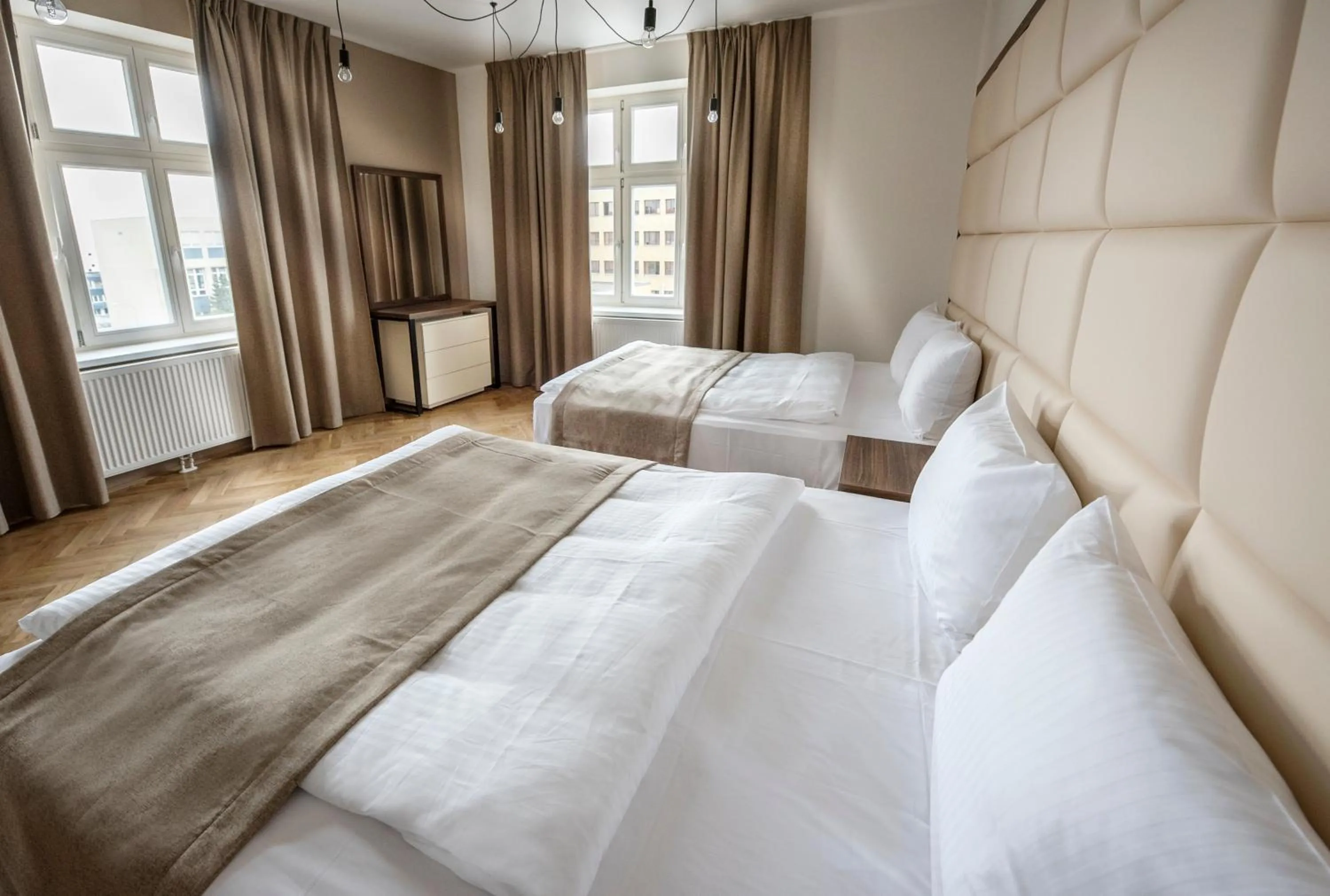 Bed in Letna Garden Suites