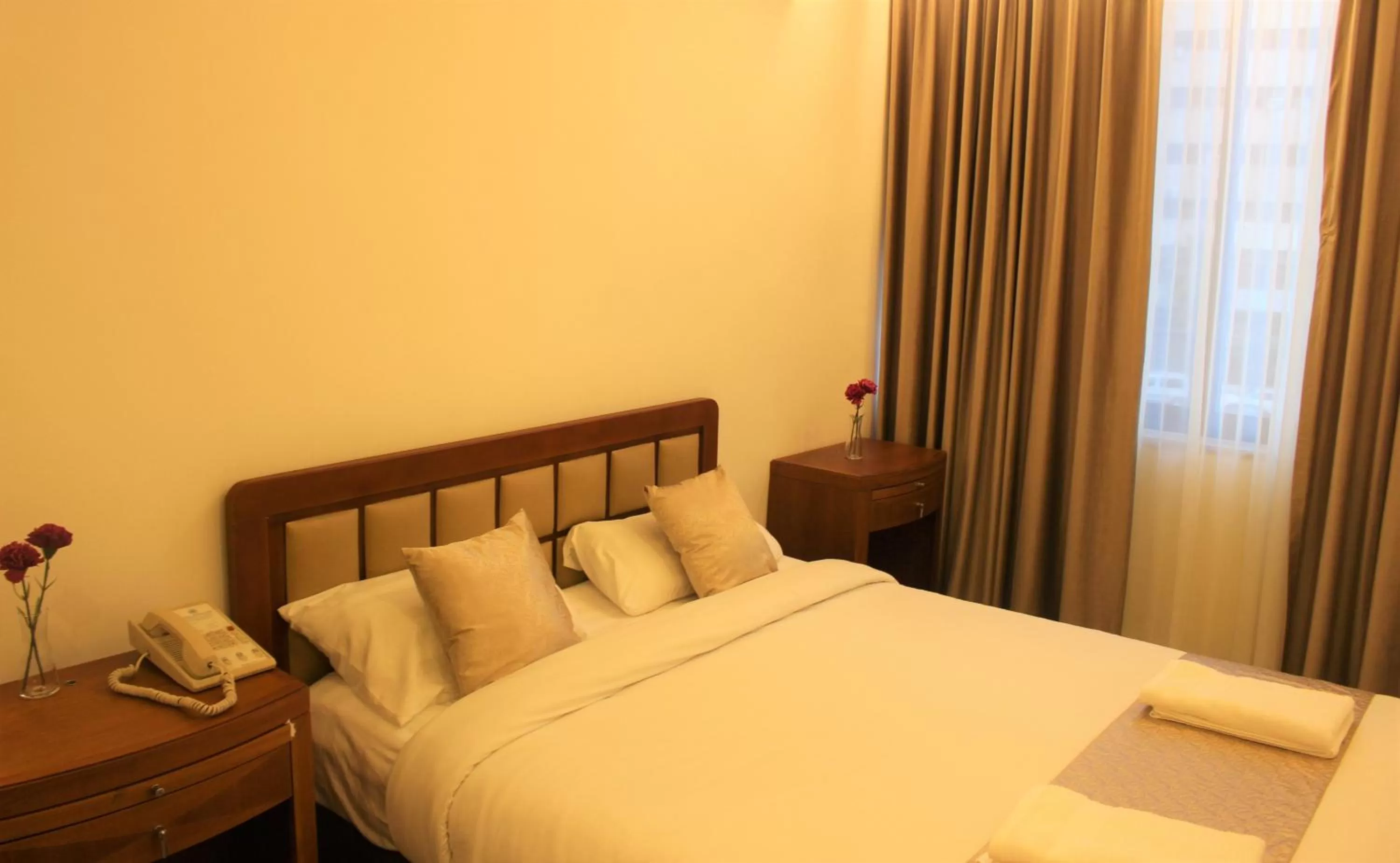 Bed in New MerryLand Hotel