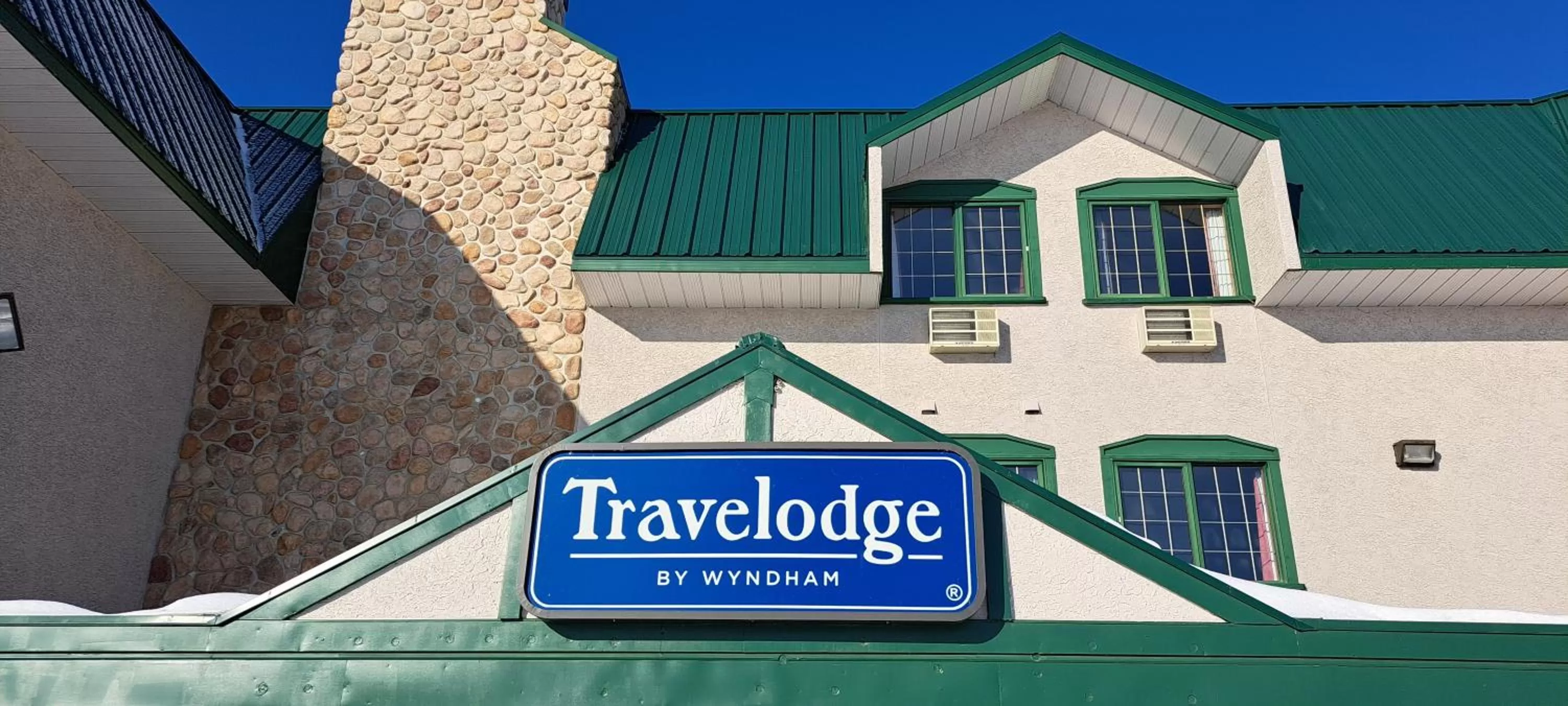 Property logo or sign in Travelodge by Wyndham Lacombe