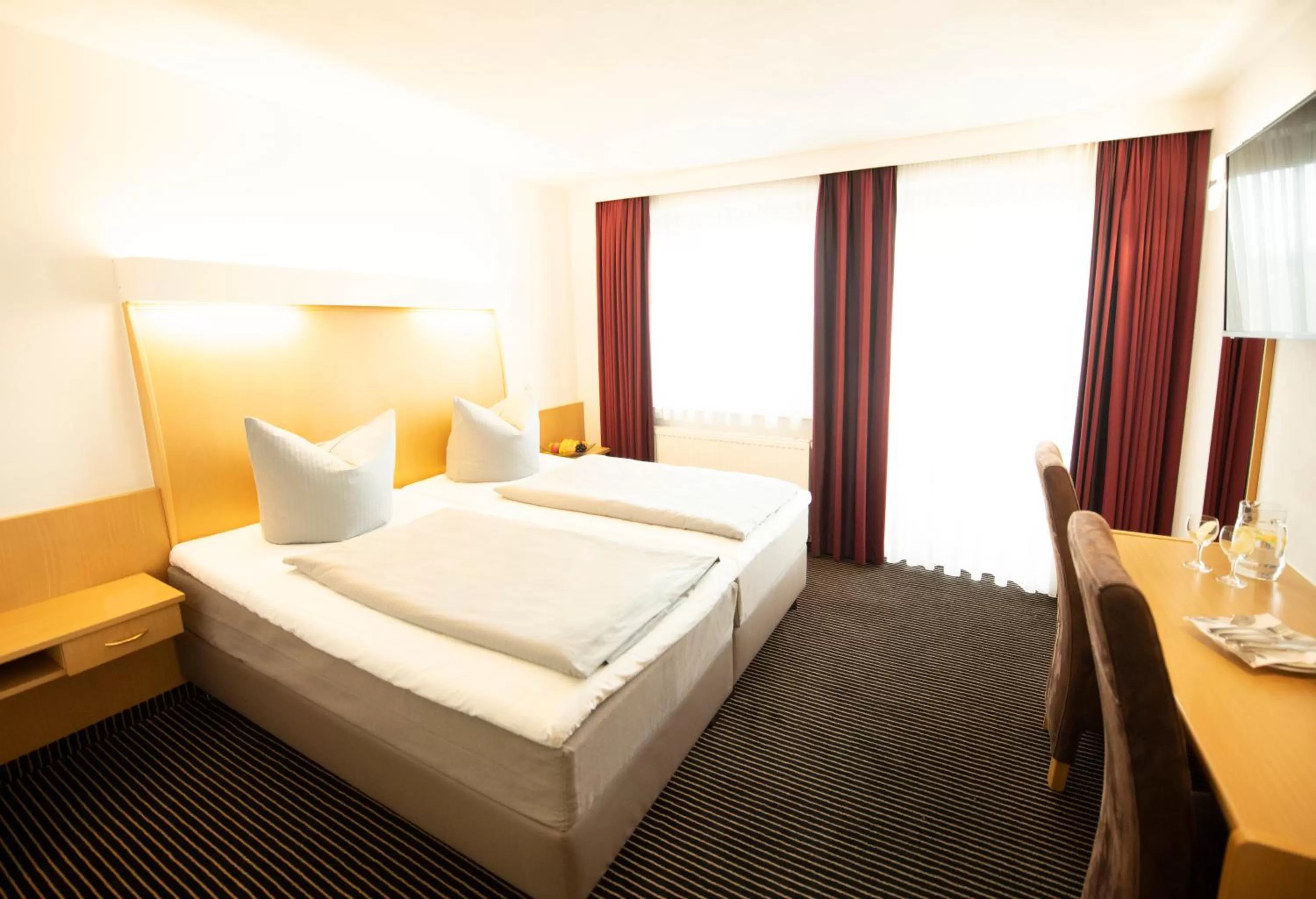 Photo of the whole room, Bed in Stadthotel Giengen