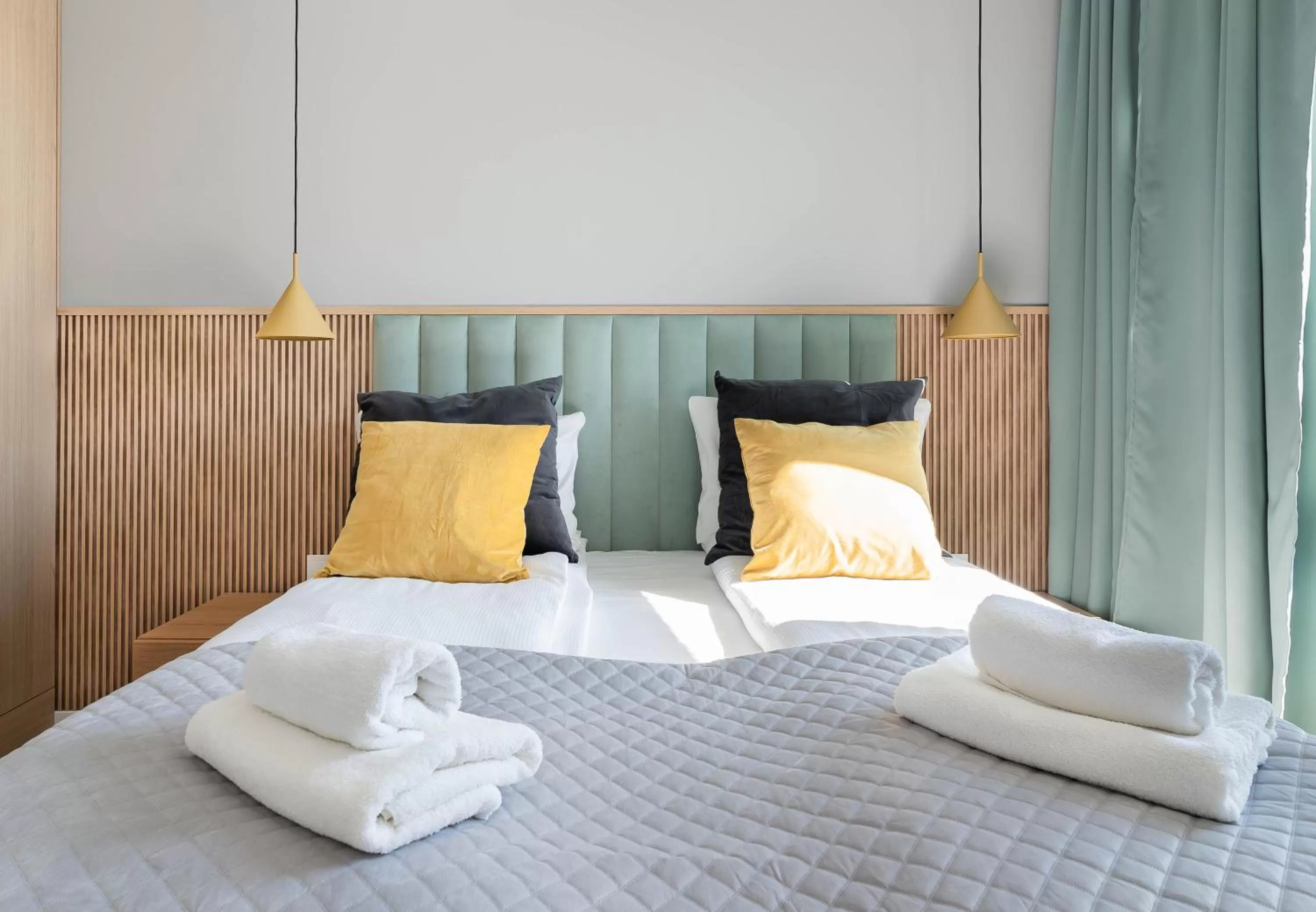 Bed in Symphony Modern Tower Apartamenty