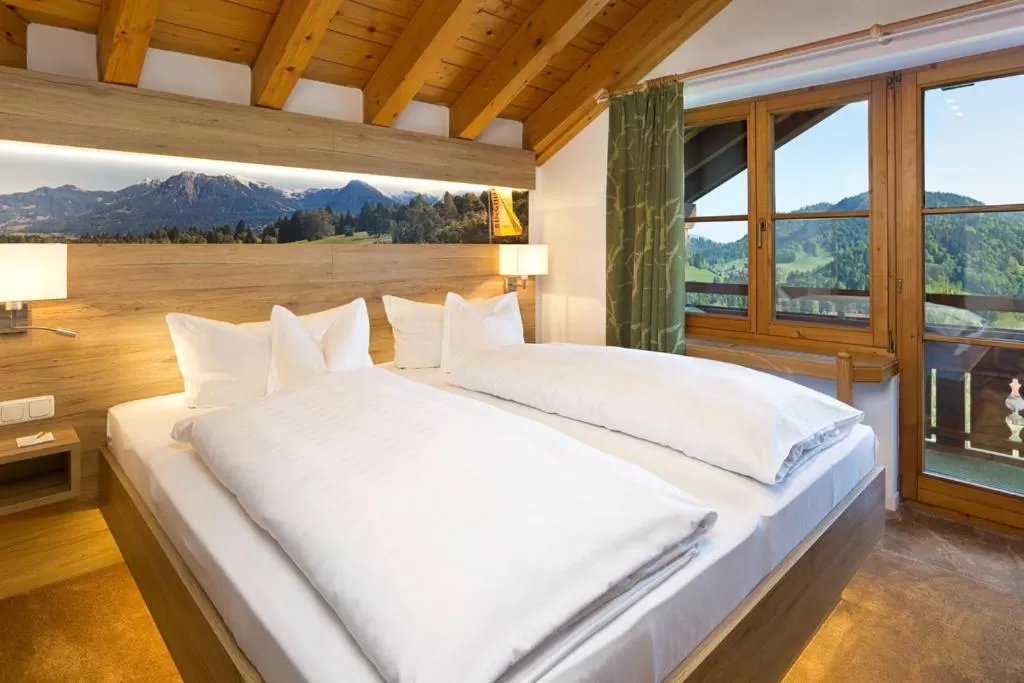 Photo of the whole room, Bed in Ringhotel Nebelhornblick