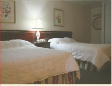 Bed in Caravelle Inn & Suites