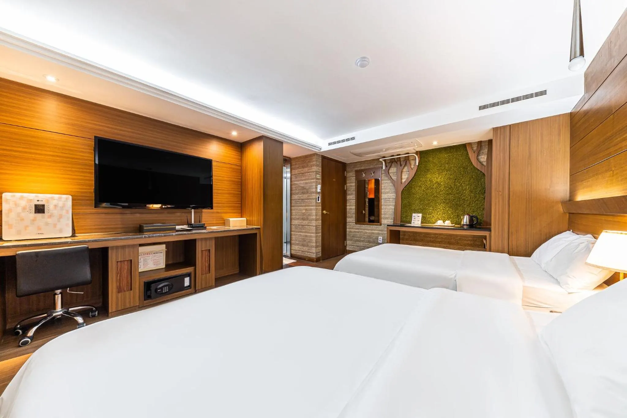 Bed in Friendly DH Naissance Hotel by Mindrum Group