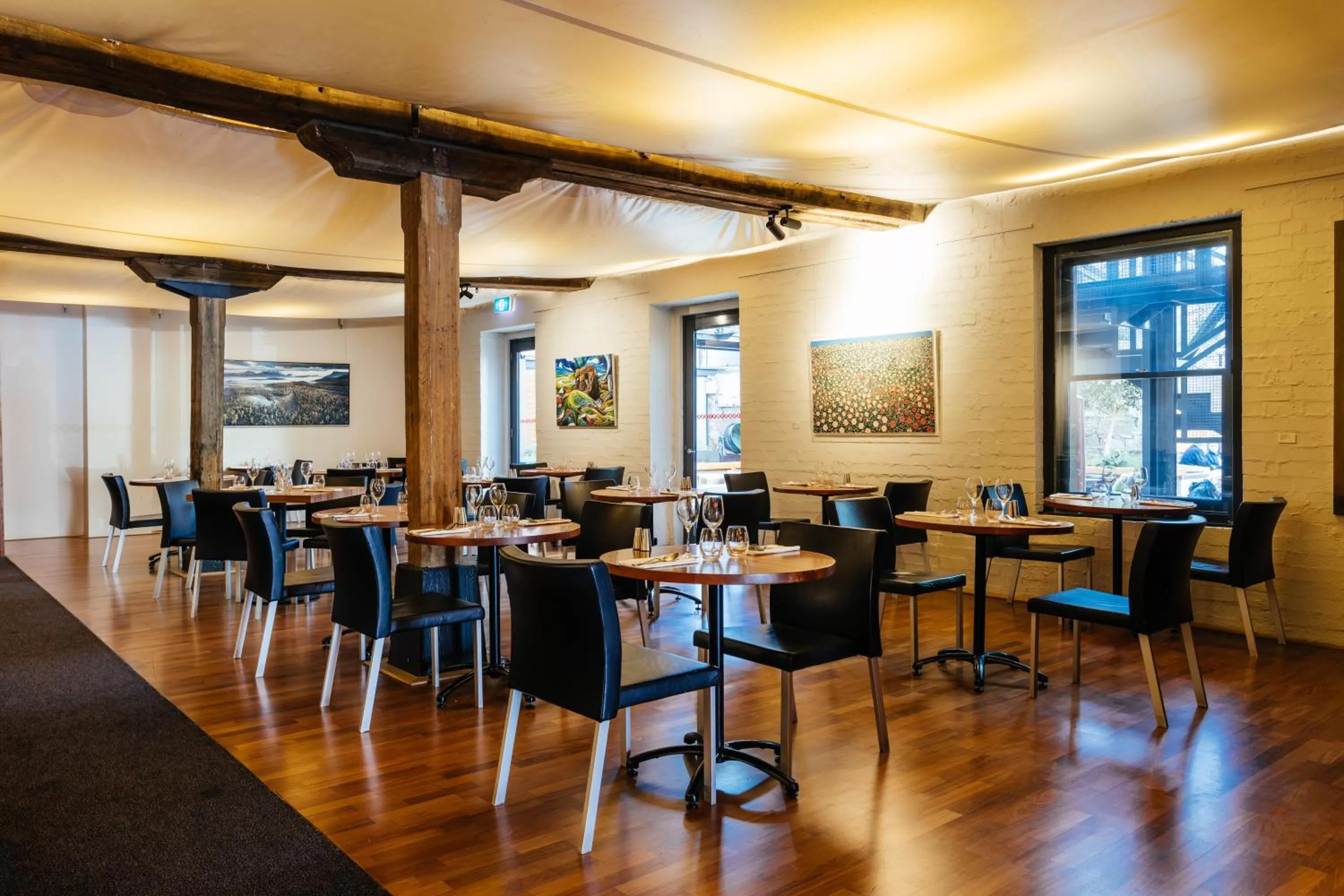 Communal lounge/ TV room in The Henry Jones Art Hotel