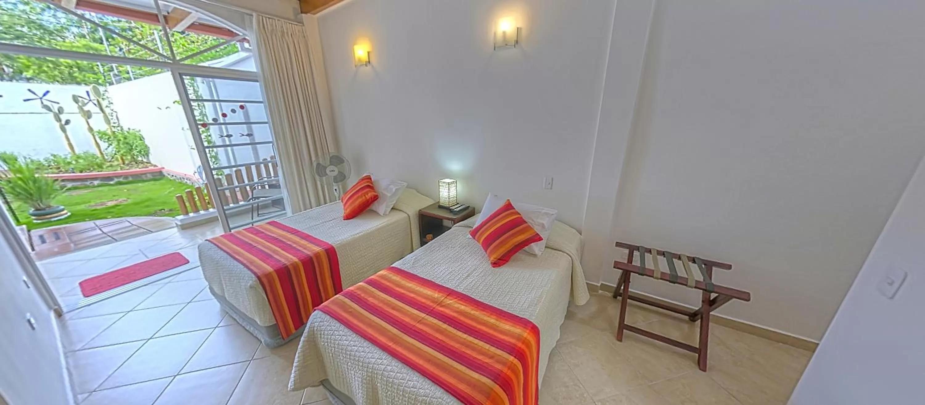 Bed in Hotel Galapagos Suites B&B