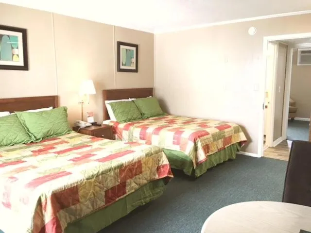 Bed in Polynesian Oceanfront Hotel