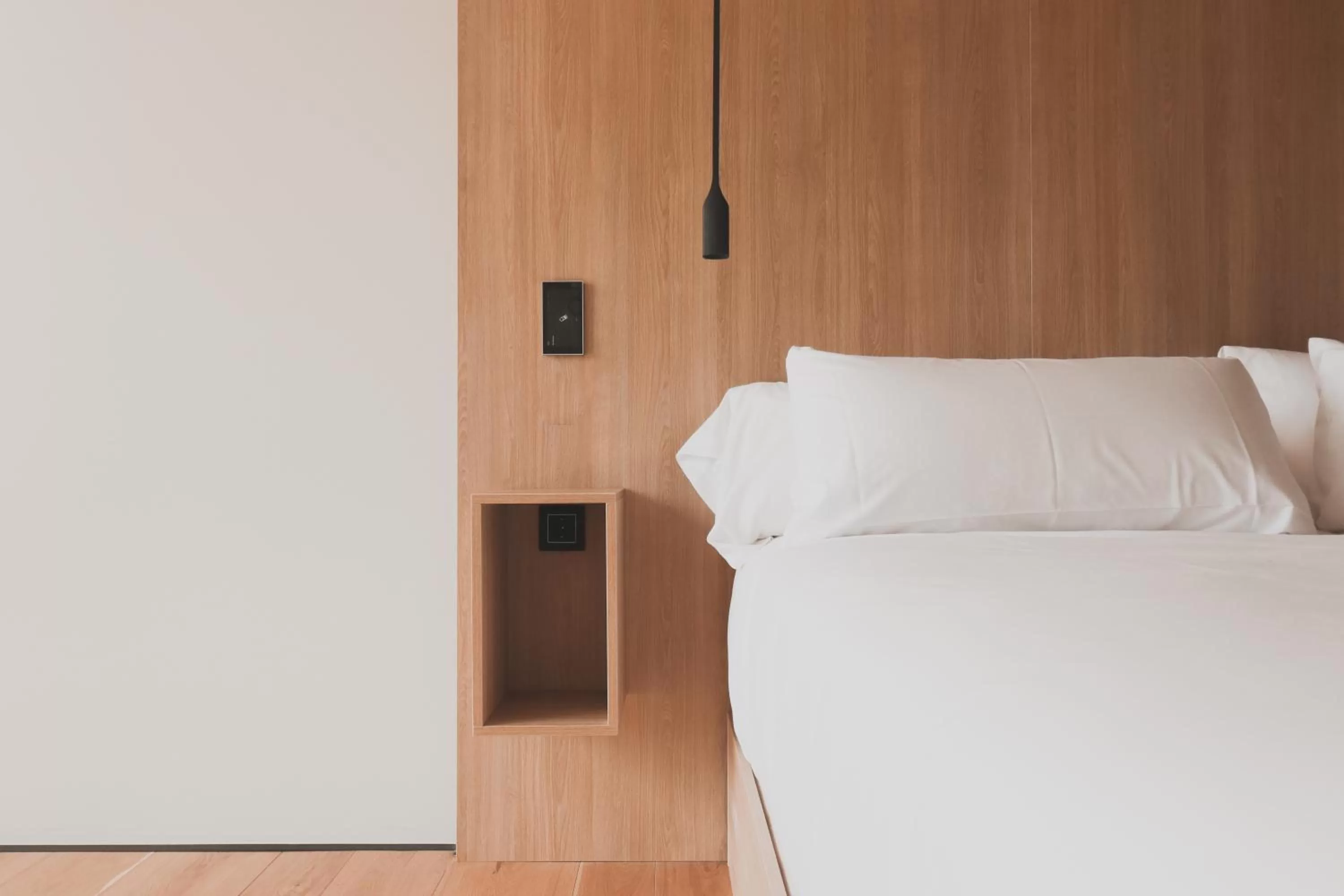 Bed in Atmos Hotel Boutique