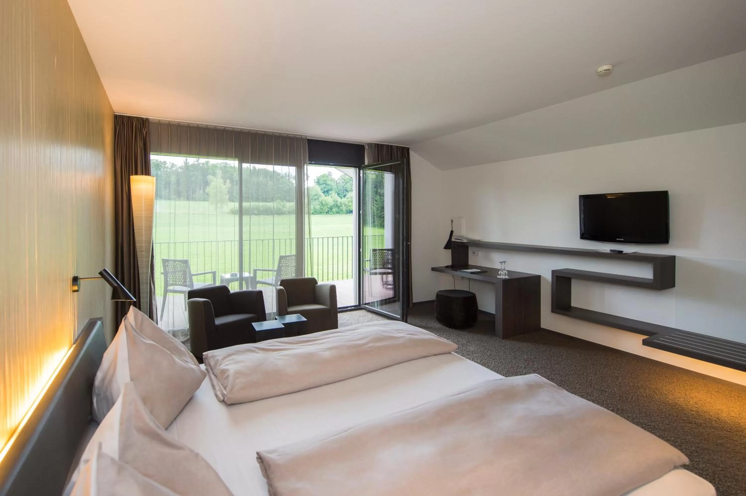 Photo of the whole room, Bed in Wellnesshotel Golfpanorama