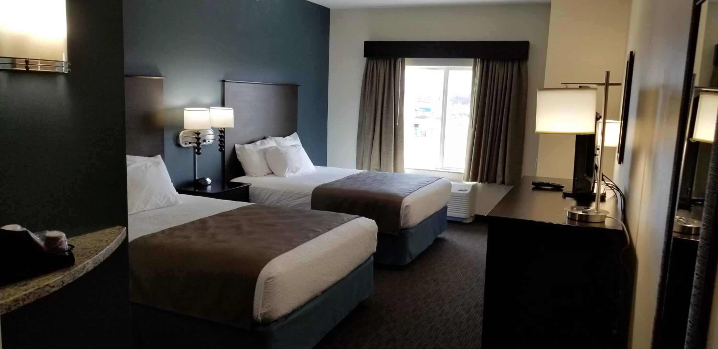 Bed in AmericInn by Wyndham Sioux Falls North