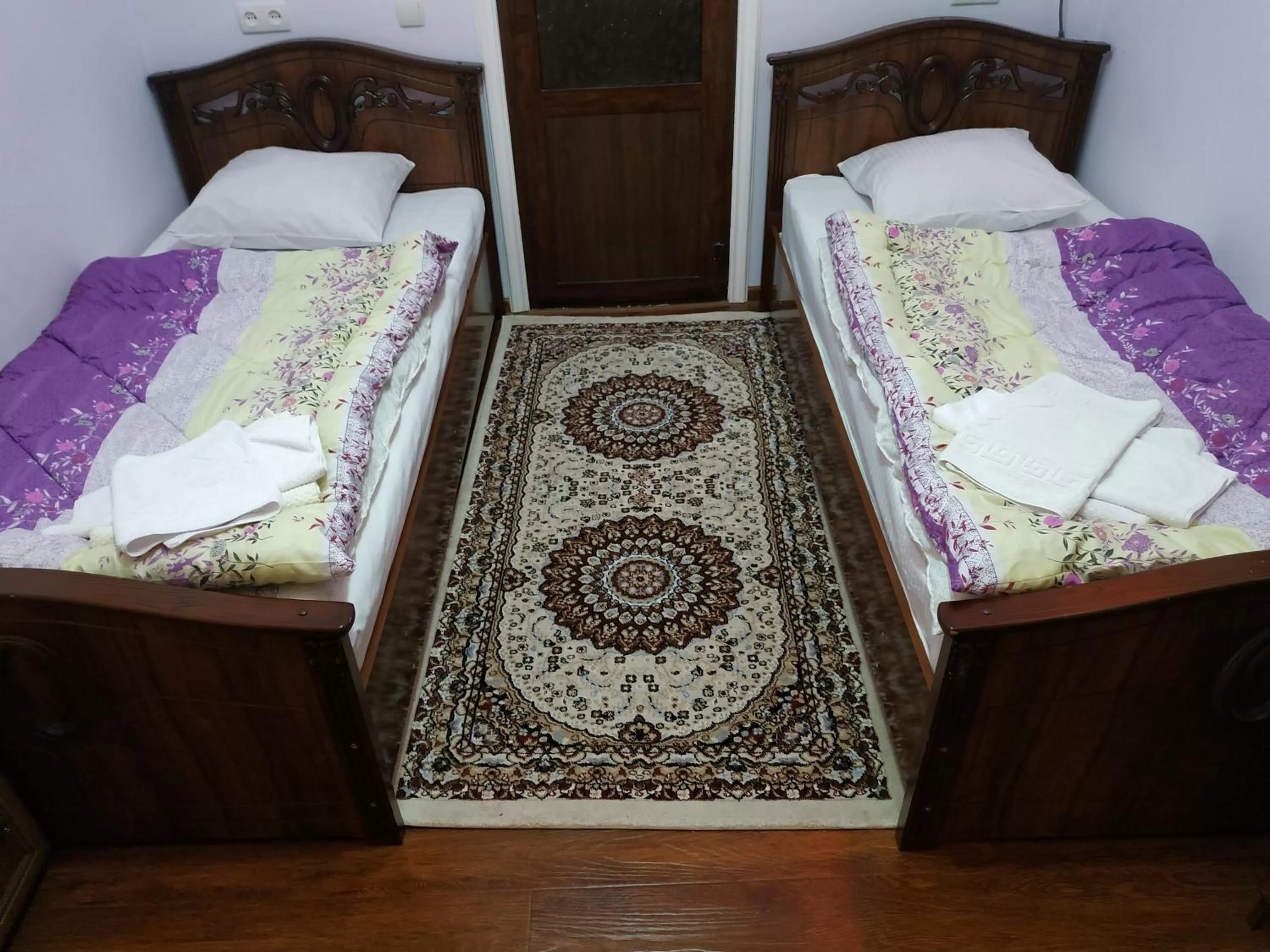 Bed in Tilyakori Hotel