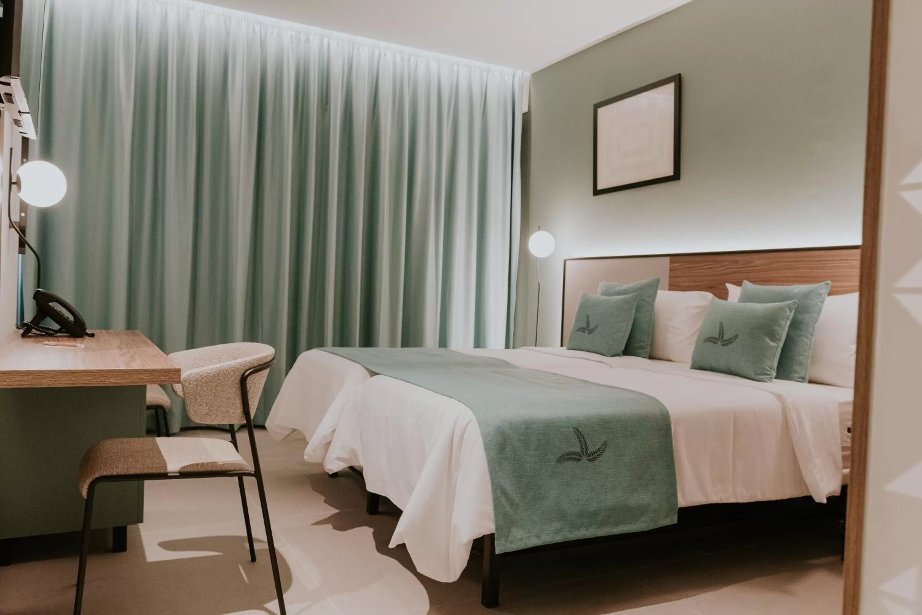 Bed in Catalina Plaza Hotel Sostenible