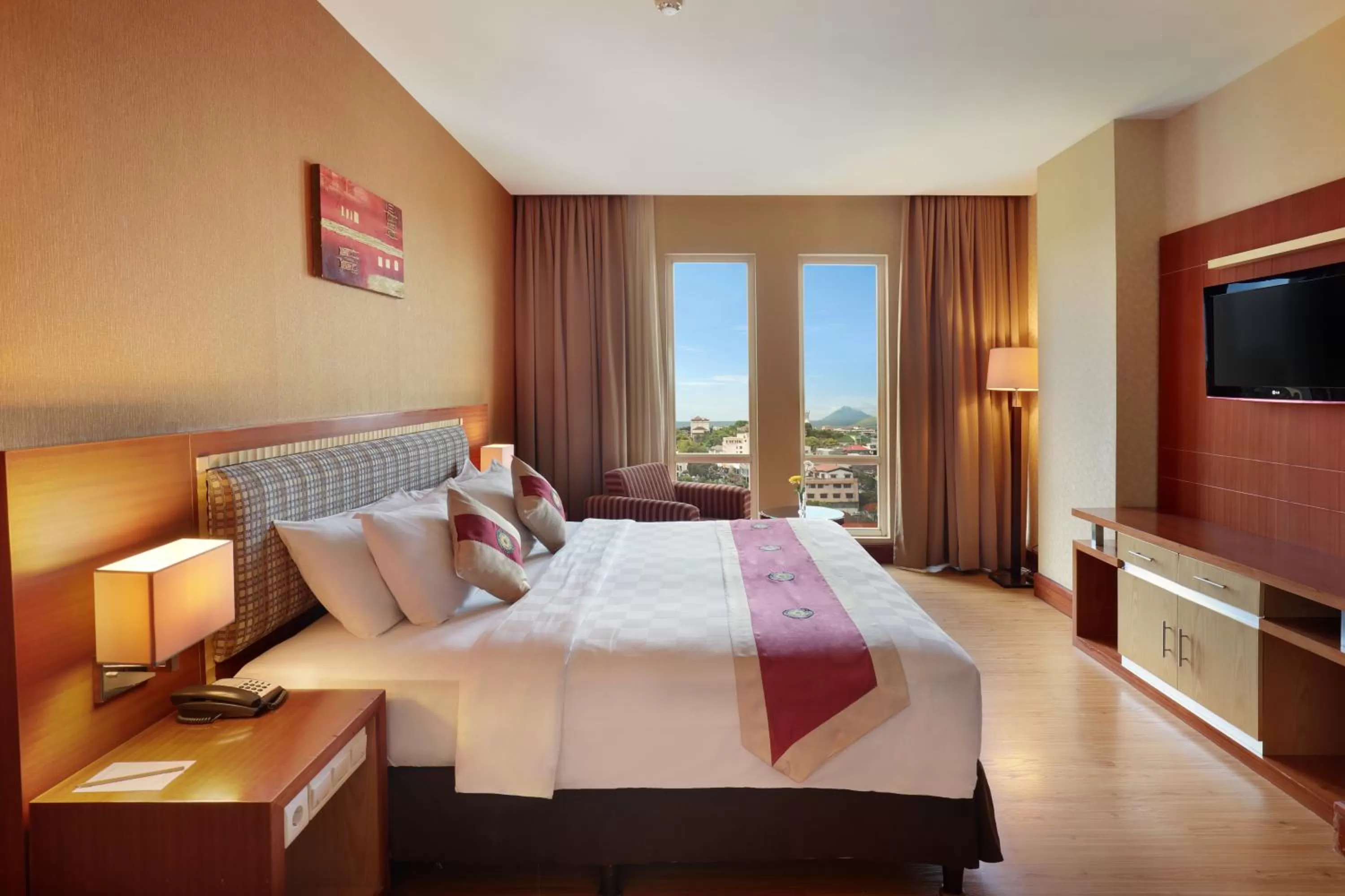 Photo of the whole room, Bed in Swiss-Belhotel Maleosan Manado