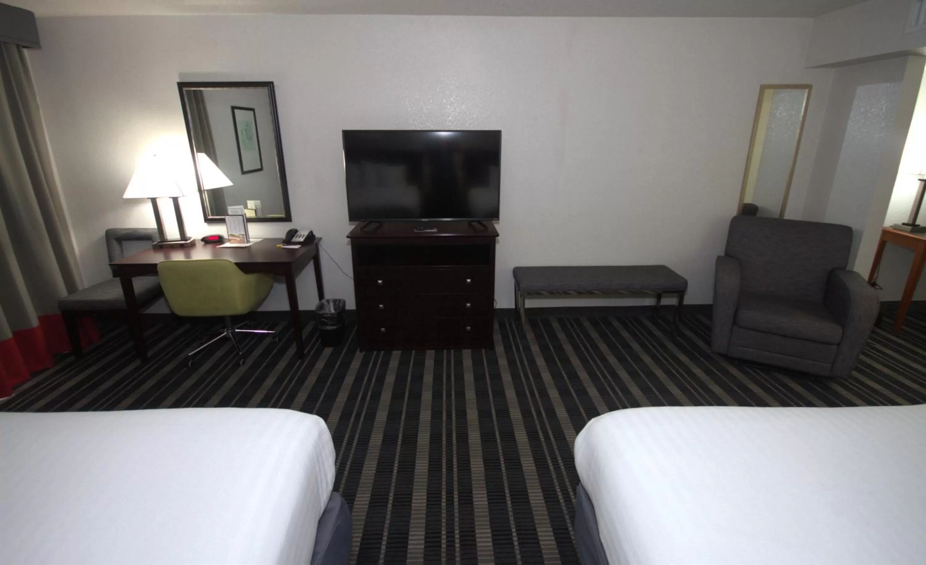 Bedroom, Bed in Atrium Hotel and Suites DFW Airport