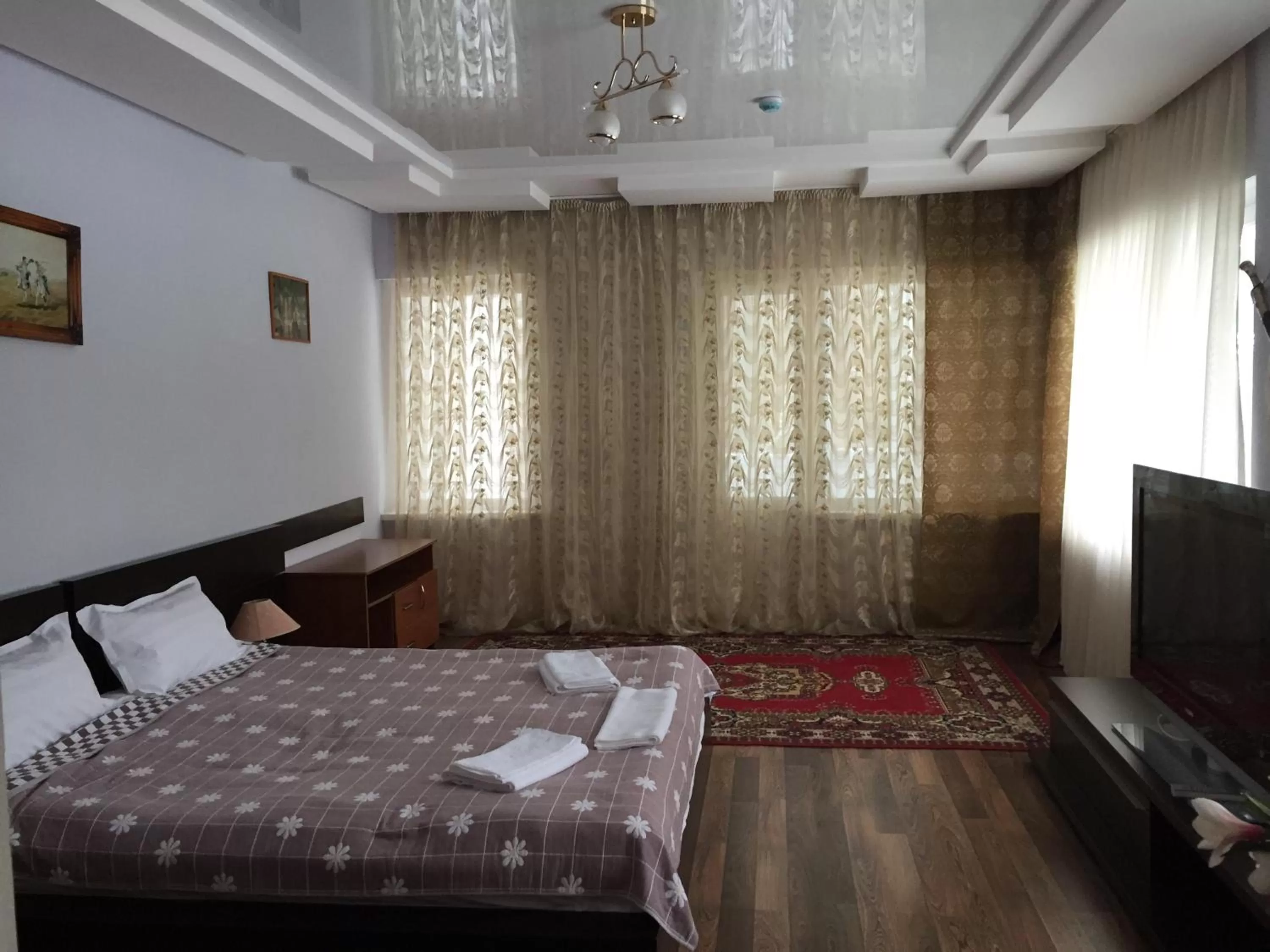 Bed in Zhaylau Hotel