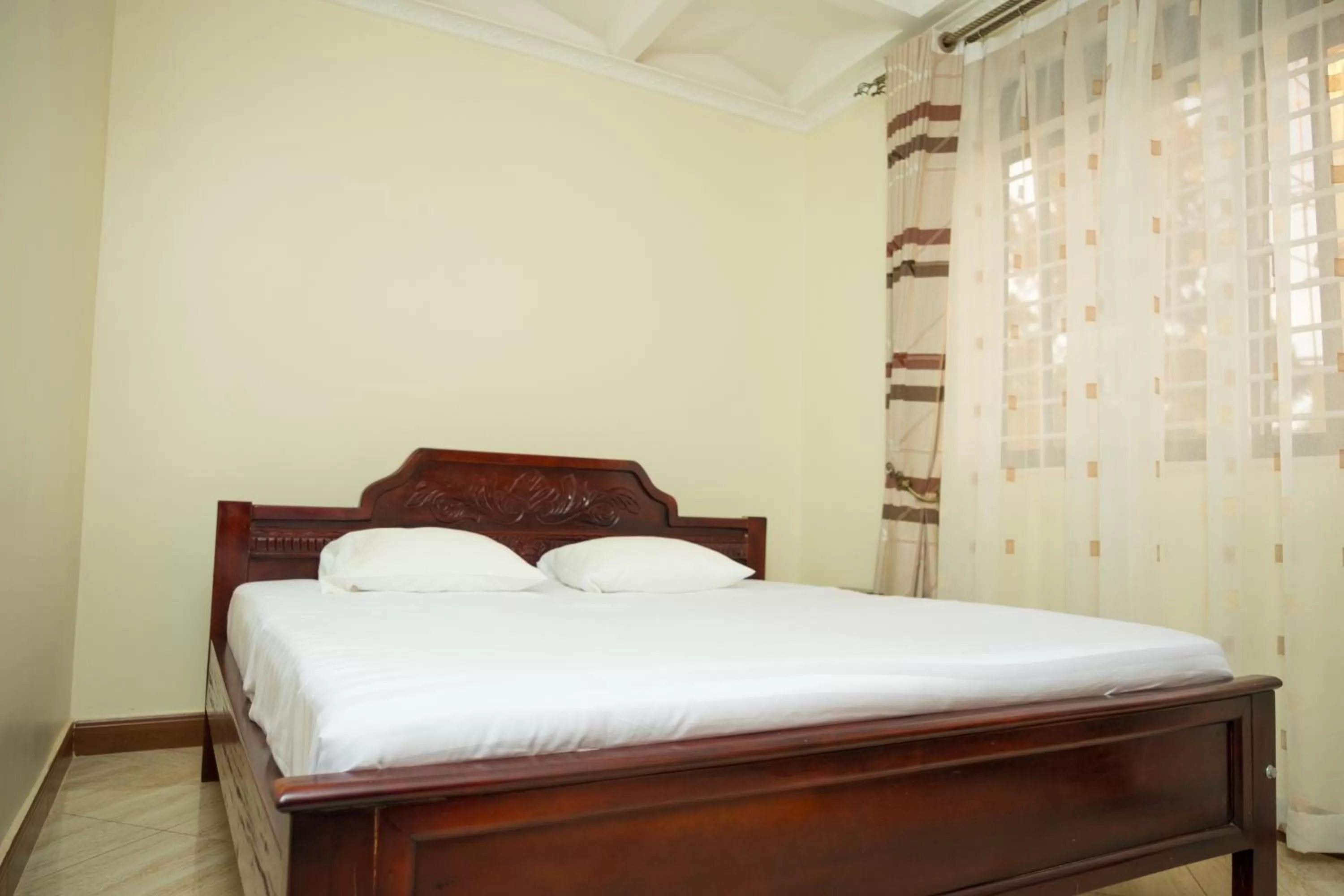 Bed in Kampala Suburbs Apartment