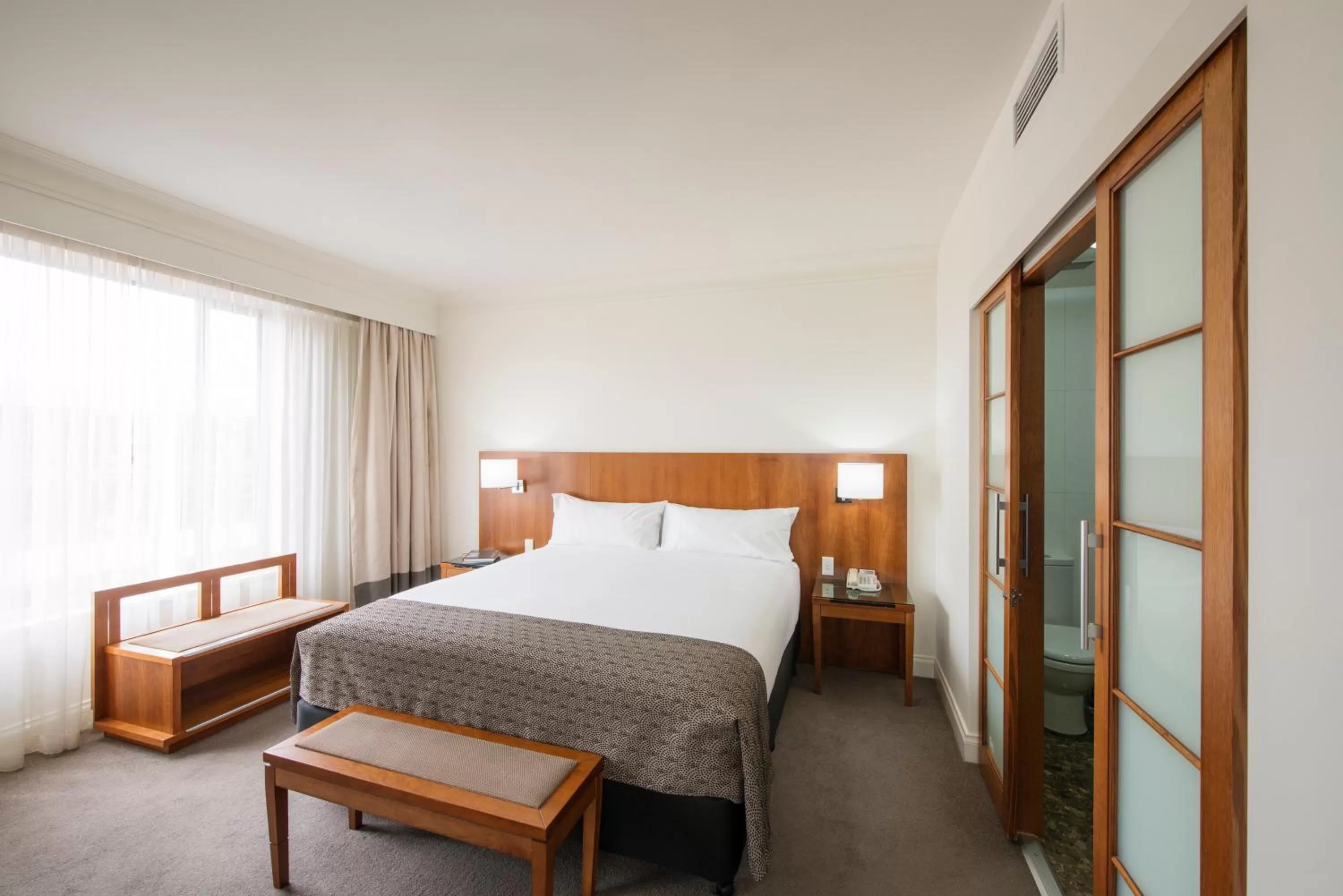 Bed in Majestic Roof Garden Hotel