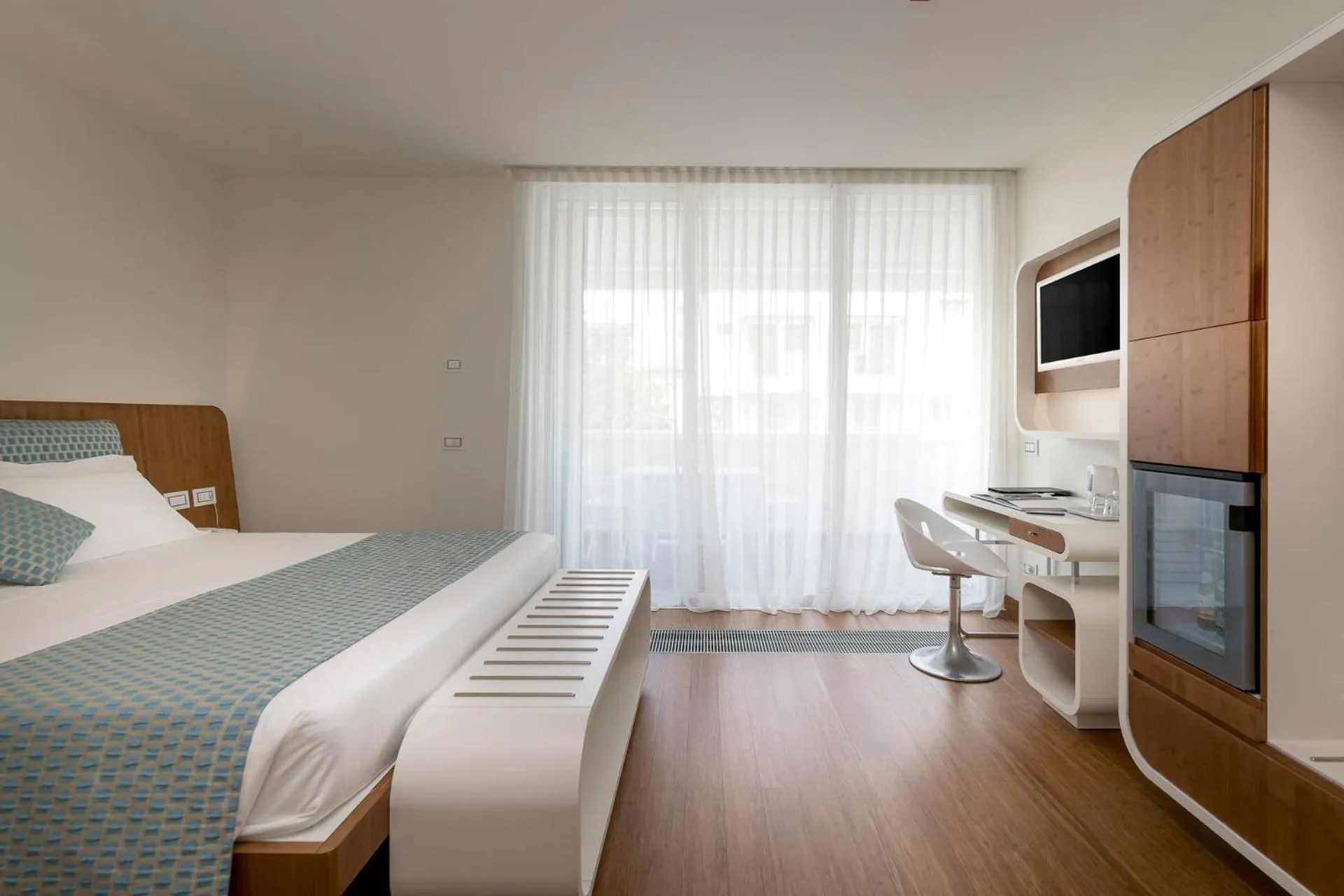 Bed in T-Suite Hotel