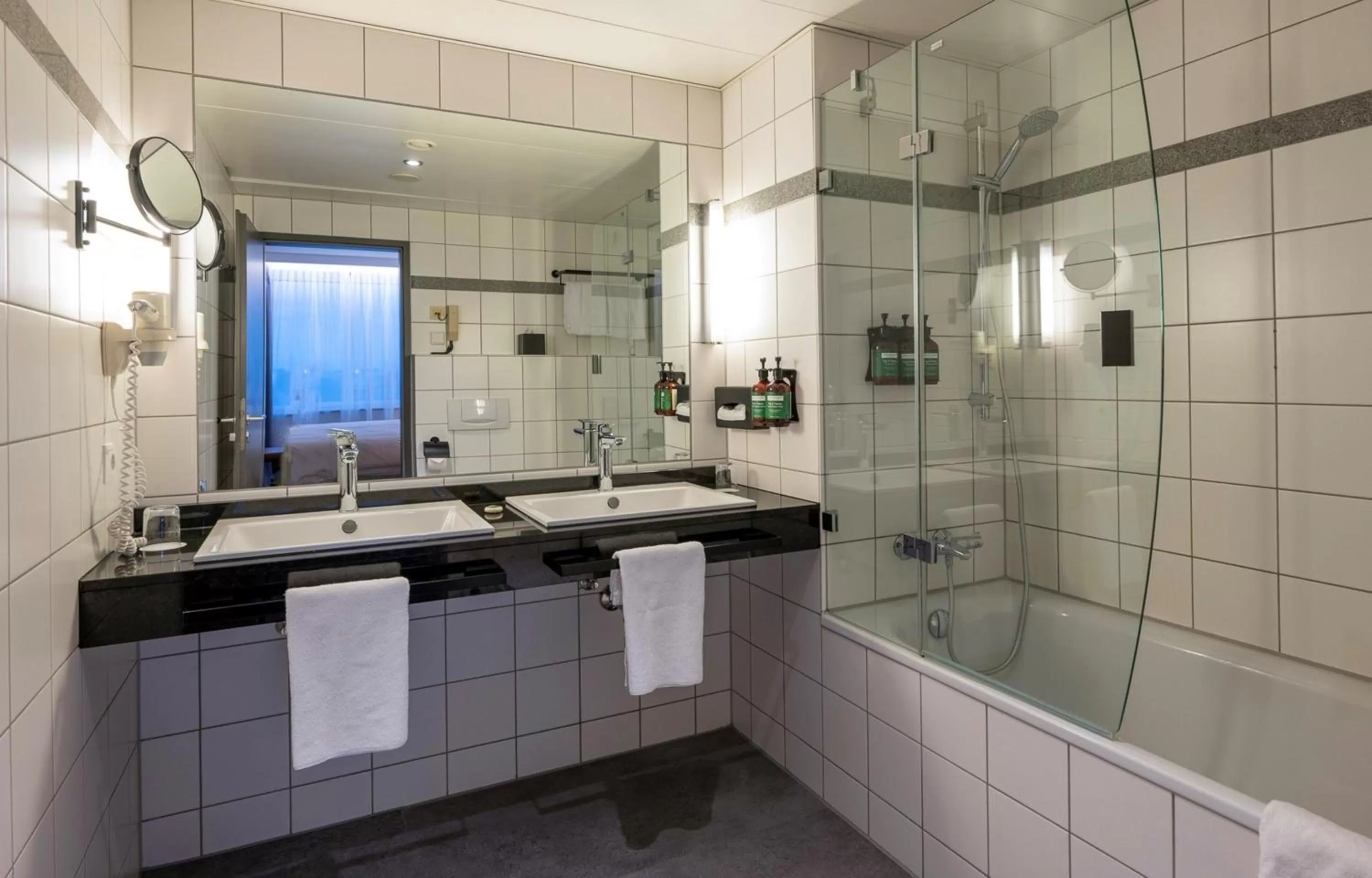 Bathroom in voco Dusseldorf Seestern by IHG